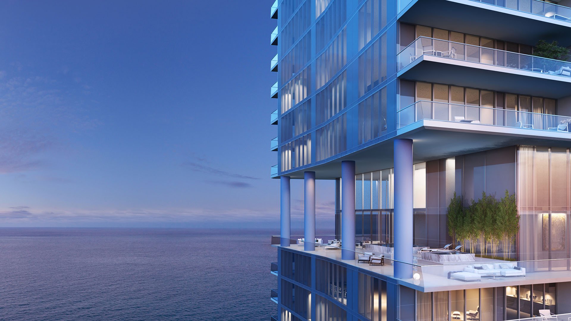Turnberry Ocean Club in Sunny Isles Beach luxury and ultra luxury condos showcase a cantilevered corner terrace with glass railings and open ocean views beside the tower facade.