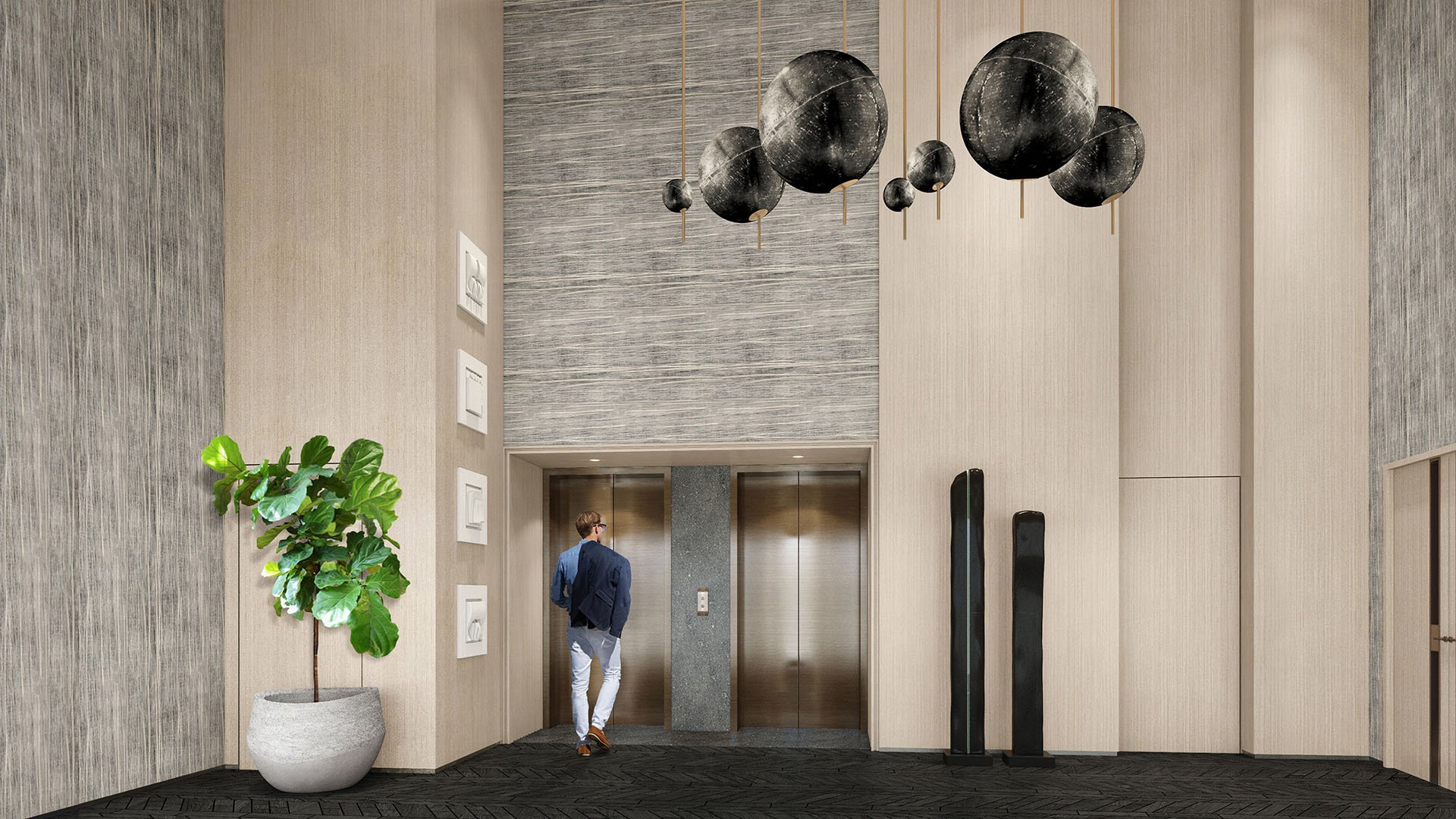 Turnberry Ocean Club in Sunny Isles Beach luxury and ultra luxury condos showcase a double-height elevator lobby with oversized pendant lights, textured walls, and stone flooring.