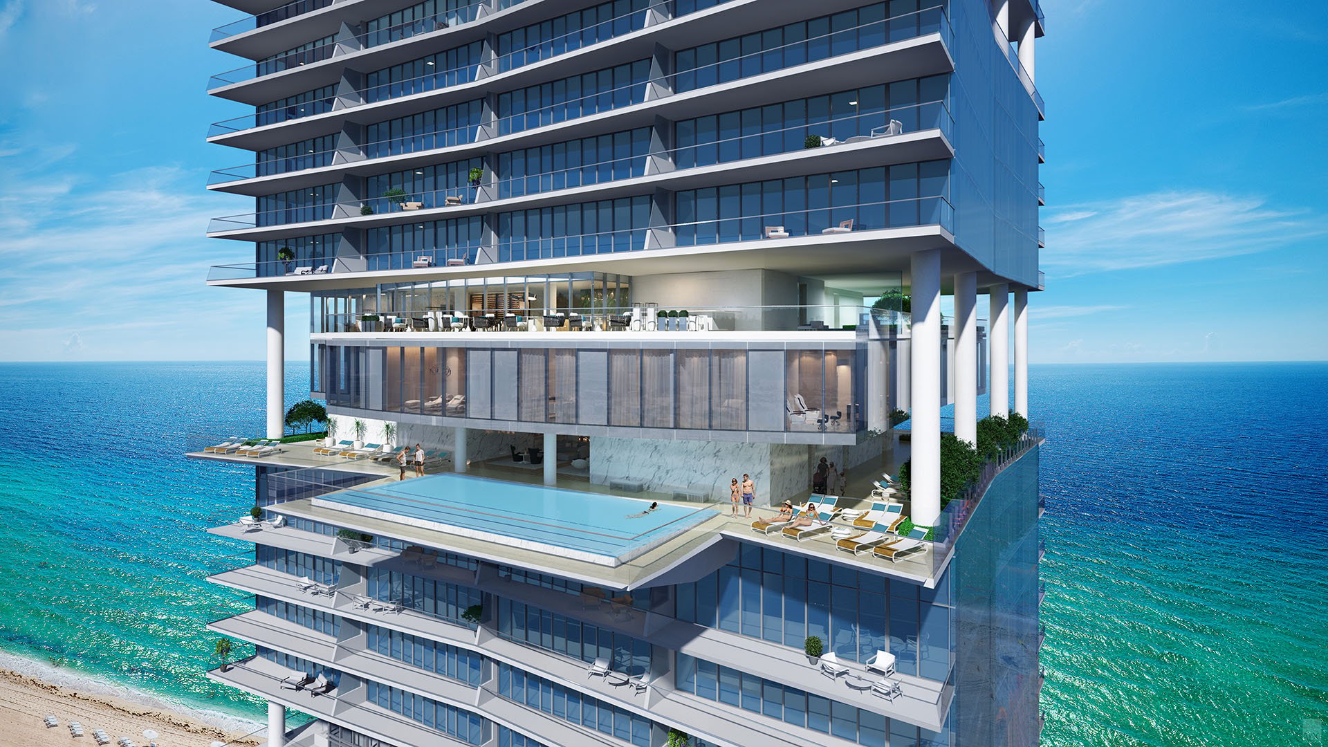 Turnberry Ocean Club in Sunny Isles Beach luxury and ultra luxury condos showcase an elevated pool deck set into the tower exterior above the ocean and beach.