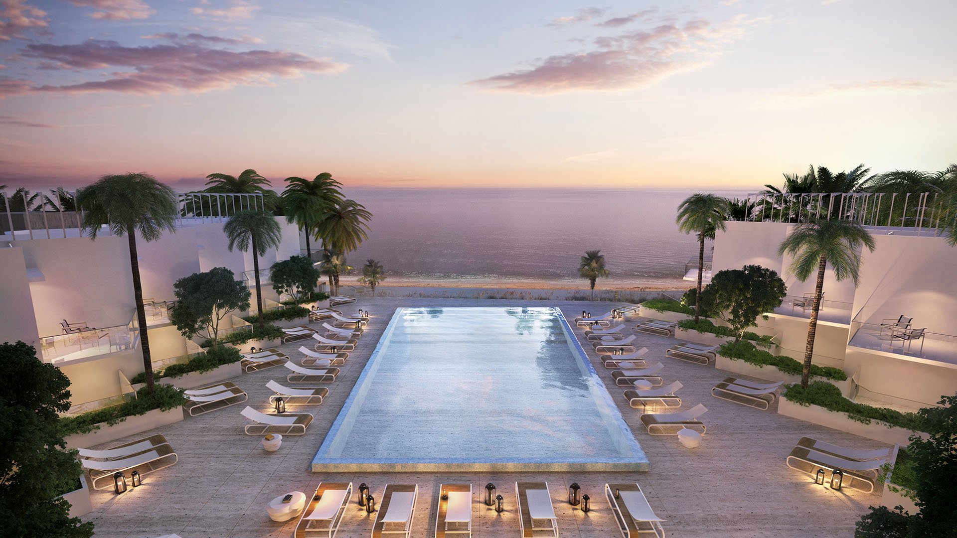 Turnberry Ocean Club in Sunny Isles Beach luxury and ultra luxury condos showcase a symmetrical pool deck with cabanas, loungers, palms, and a sunset ocean backdrop.