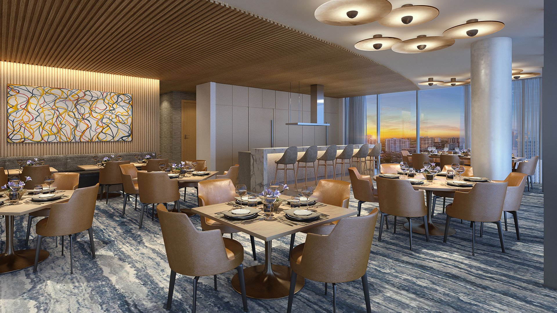 Turnberry Ocean Club in Sunny Isles Beach luxury and ultra luxury condos showcase a private dining room with an open kitchen, warm lighting, and elegant restaurant-style seating.