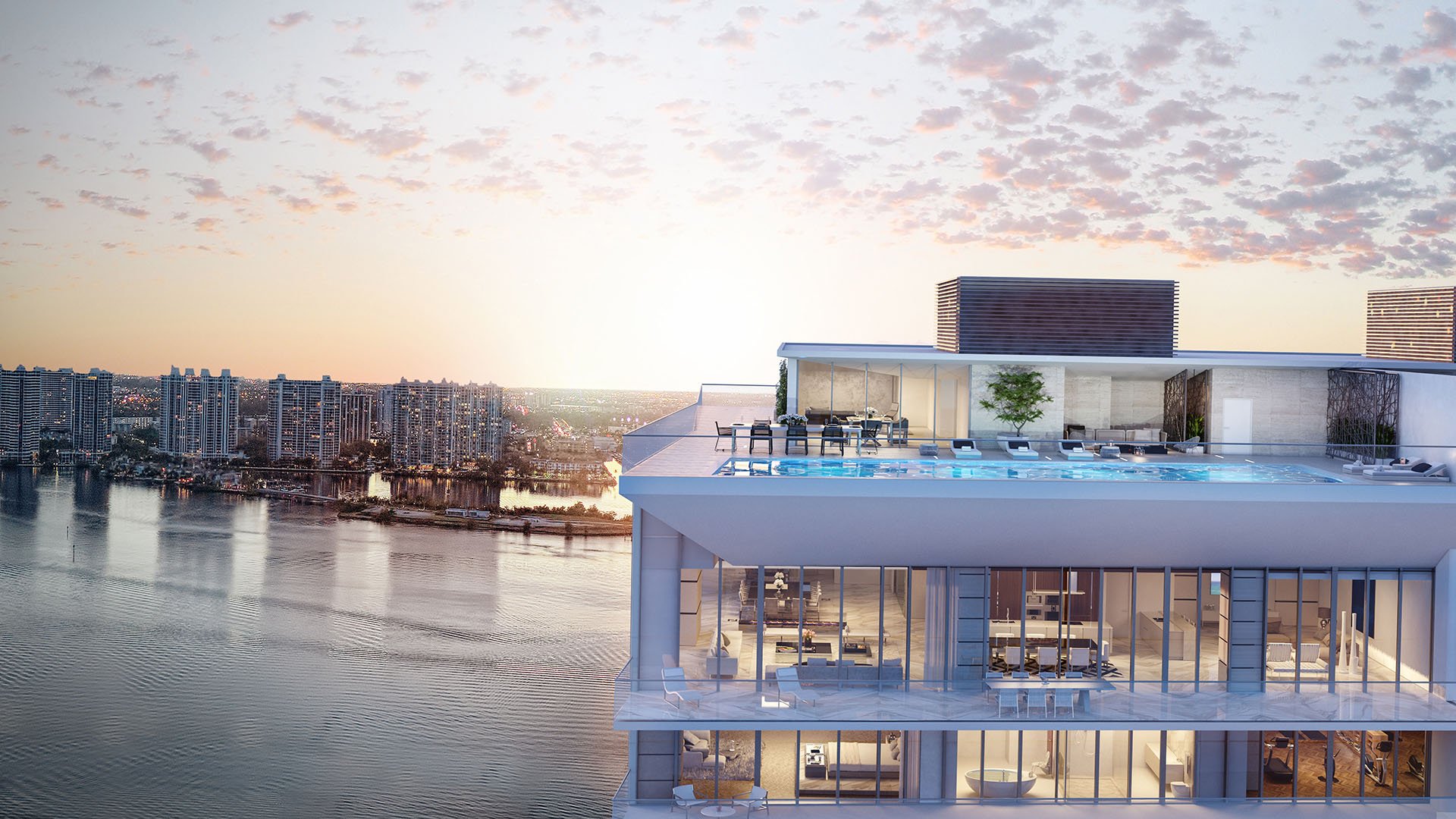 Preconstruction Turnberry Ocean Club in Sunny Isles Beach luxury and ultra luxury condos showcase a rooftop residence aerial with glowing amenity rooms and bay views at sunrise.