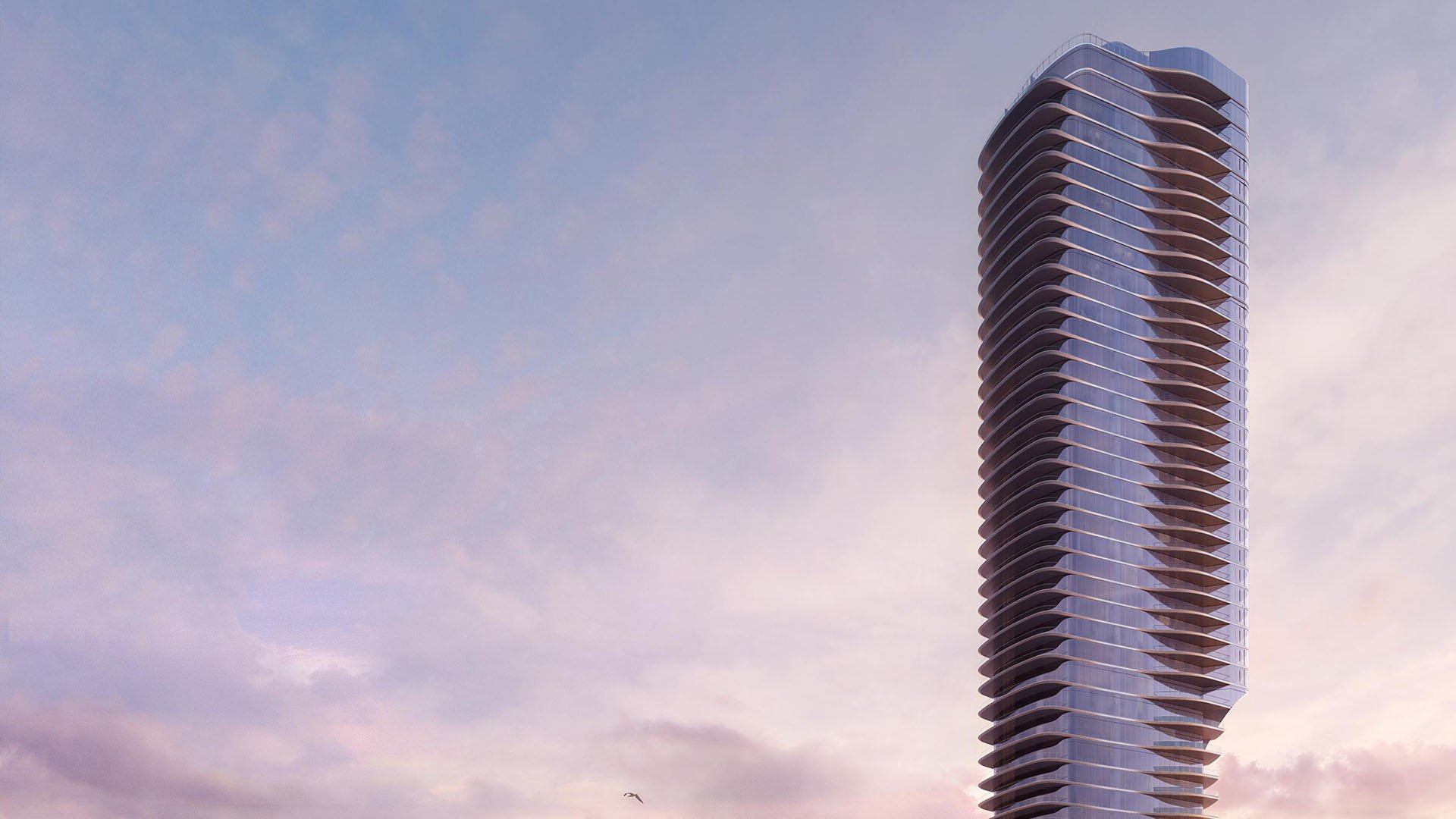 Una Residences Brickell, Miami residential tower exterior at dusk, curved glass balconies rising above the skyline, showcasing luxury and ultra luxury preconstruction condos and signature architecture on Biscayne Bay.