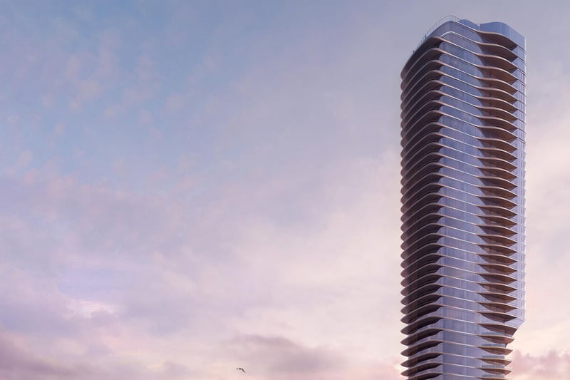 Una Residences Brickell, Miami residential tower exterior at dusk, curved glass balconies rising above the skyline, showcasing luxury and ultra luxury preconstruction condos and signature architecture on Biscayne Bay.