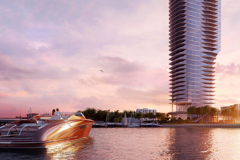 Una Residences Brickell, Miami waterfront tower and speedboat on Biscayne Bay at sunset, capturing the luxury and ultra luxury preconstruction condos lifestyle with marina access and iconic coastal skyline views.