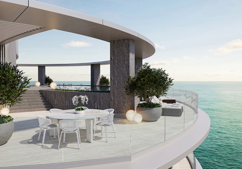 Upper Penthouse Rivage in Bal Harbour luxury and ultra luxury condos curved rooftop terrace with outdoor dining, glass railing, planters, stone columns, and ocean view.