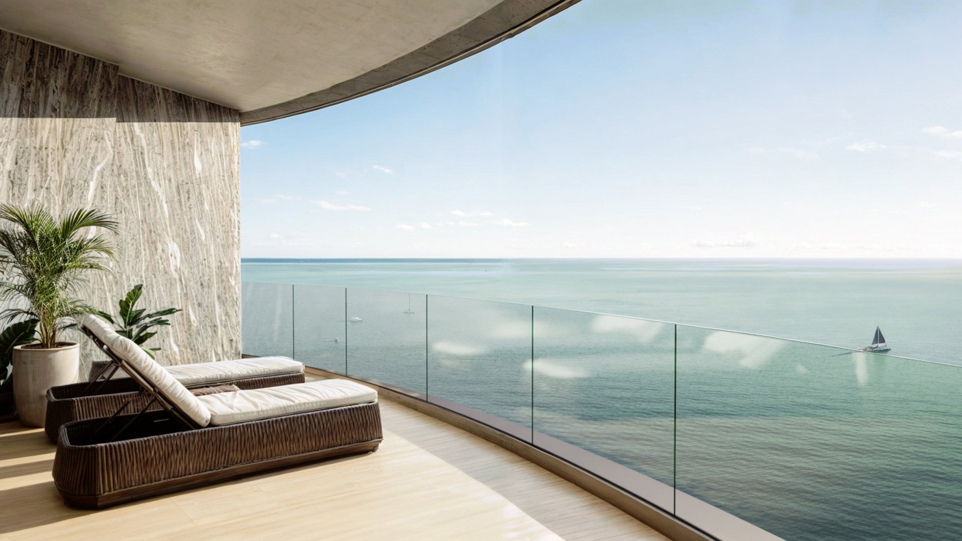 Upper Penthouse Rivage in Bal Harbour luxury and ultra luxury condos terrace with chaise loungers, glass railing, marble wall, potted greenery, sailboat, and ocean view.