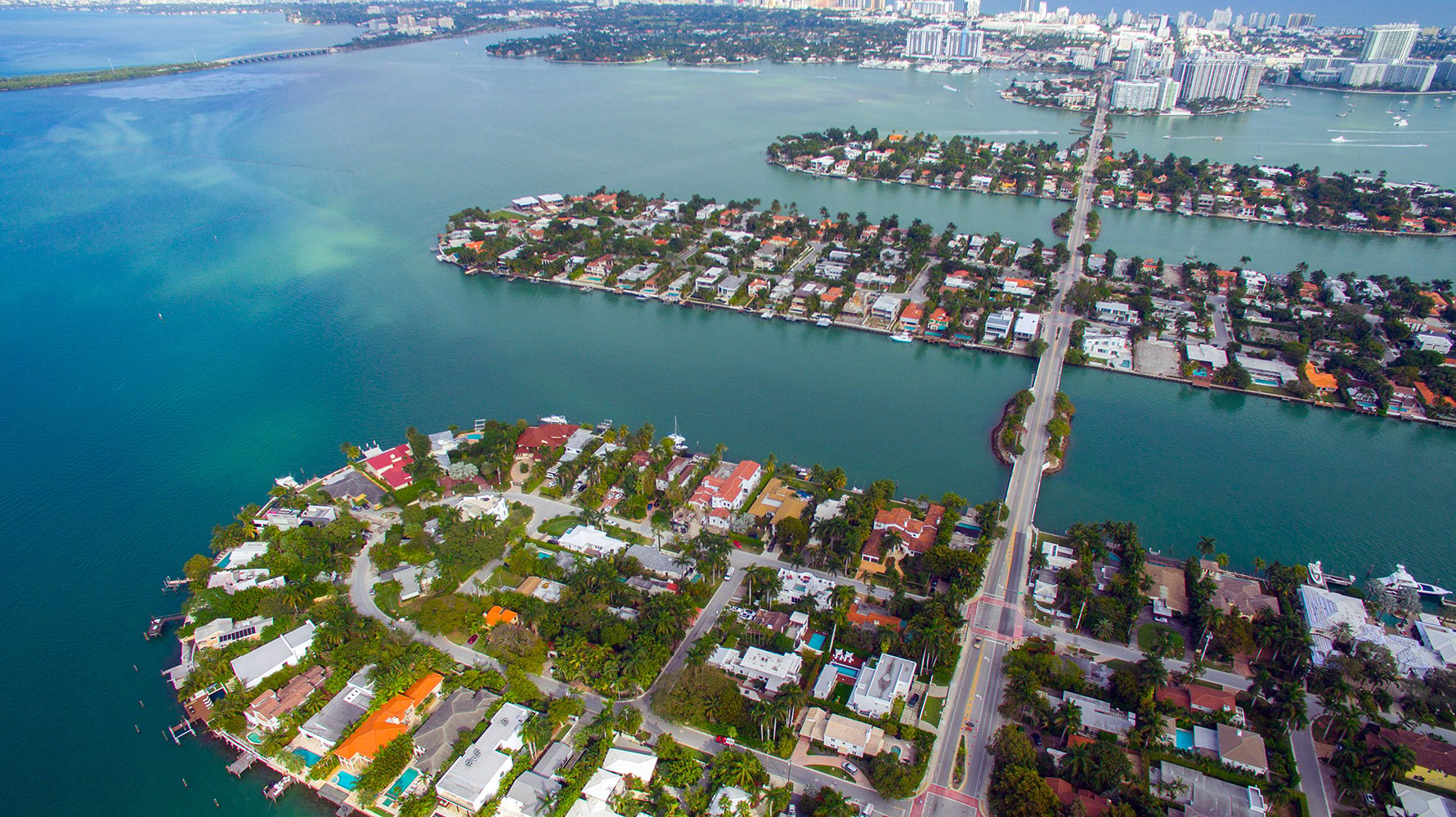 Venetian Islands, Miami aerial of islands and waterfront homes, boating lifestyle near luxury and ultra luxury condos. Featuring island view.