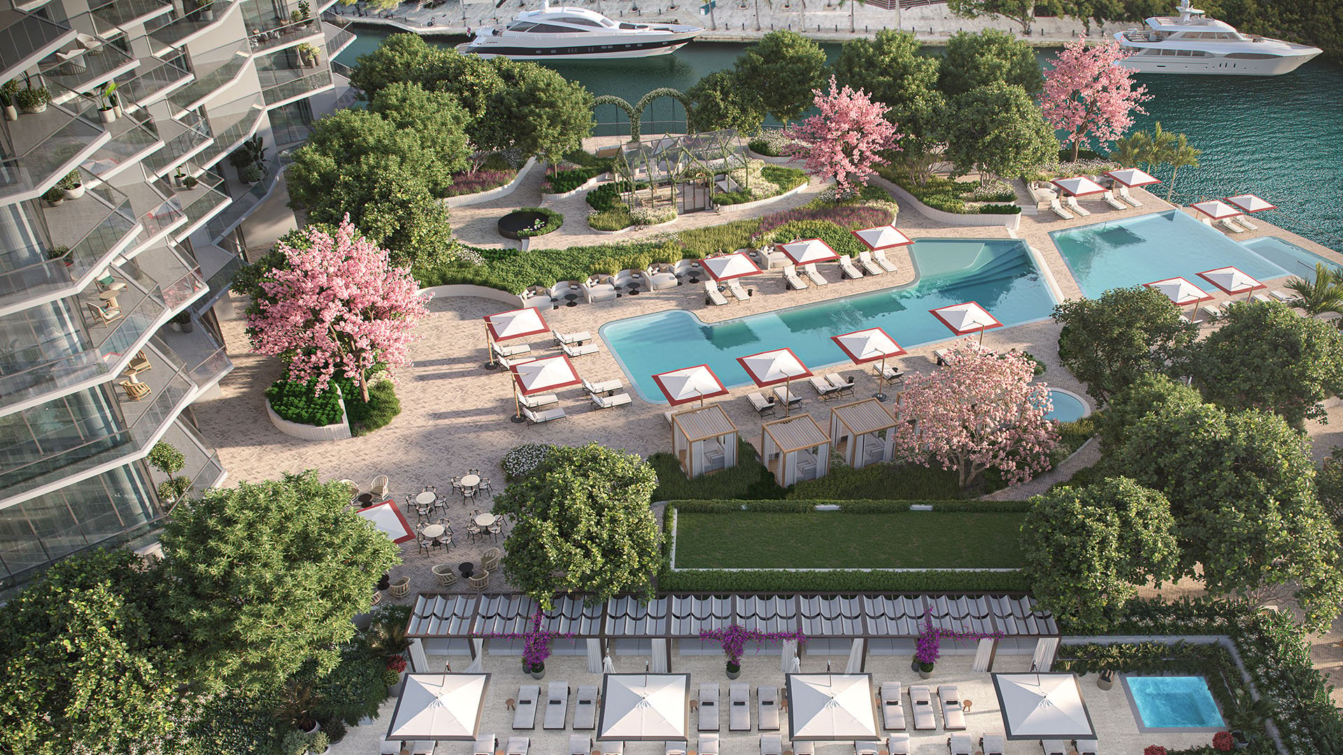 Viceroy Brickell The Residences in Brickell, Miami, luxury and ultra luxury preconstruction condos with an aerial waterfront pool deck featuring cabanas, lounge chairs, landscaped gardens, and yachts along the water.