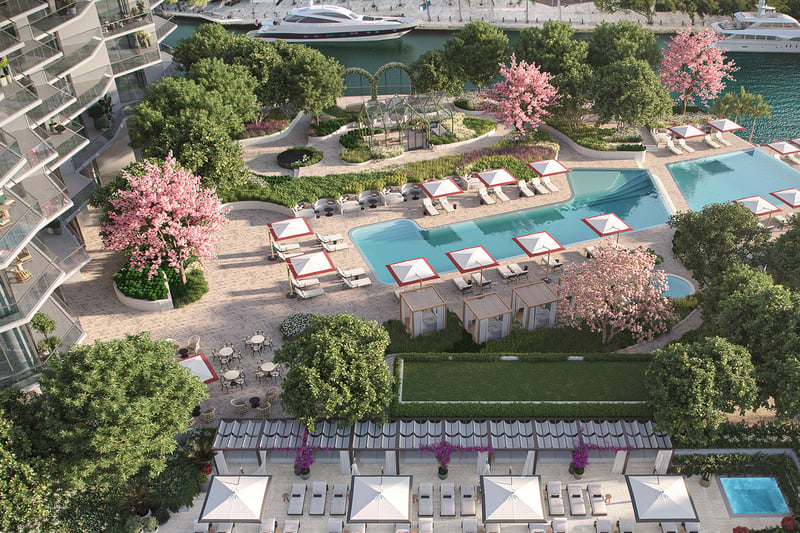 Viceroy Brickell The Residences in Brickell, Miami, luxury and ultra luxury preconstruction condos with an aerial waterfront pool deck featuring cabanas, lounge chairs, landscaped gardens, and yachts along the water.