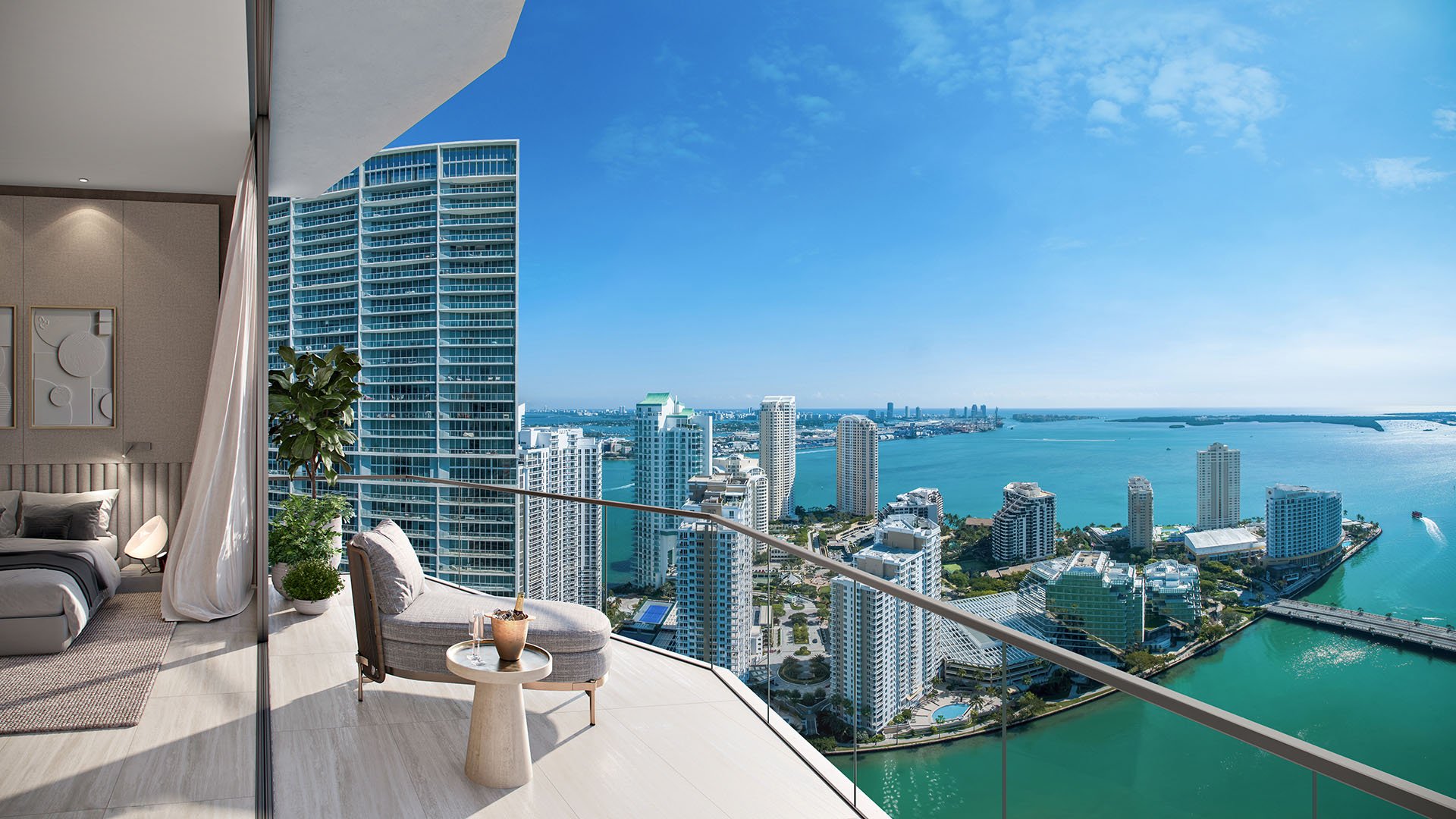 Viceroy Brickell The Residences in Brickell, Miami, luxury and ultra luxury preconstruction condos with a bedroom opening to a furnished terrace overlooking bayfront water, high-rise towers, and the skyline.