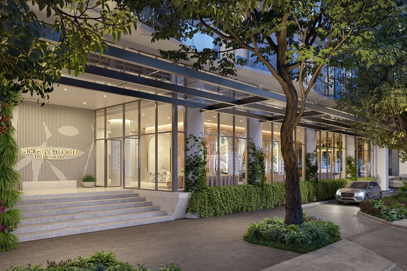 Viceroy Brickell The Residences in Brickell, Miami, luxury and ultra luxury preconstruction condos with a landscaped porte cochere arrival, canopy, glass facade, entry steps, and a car at the curb.