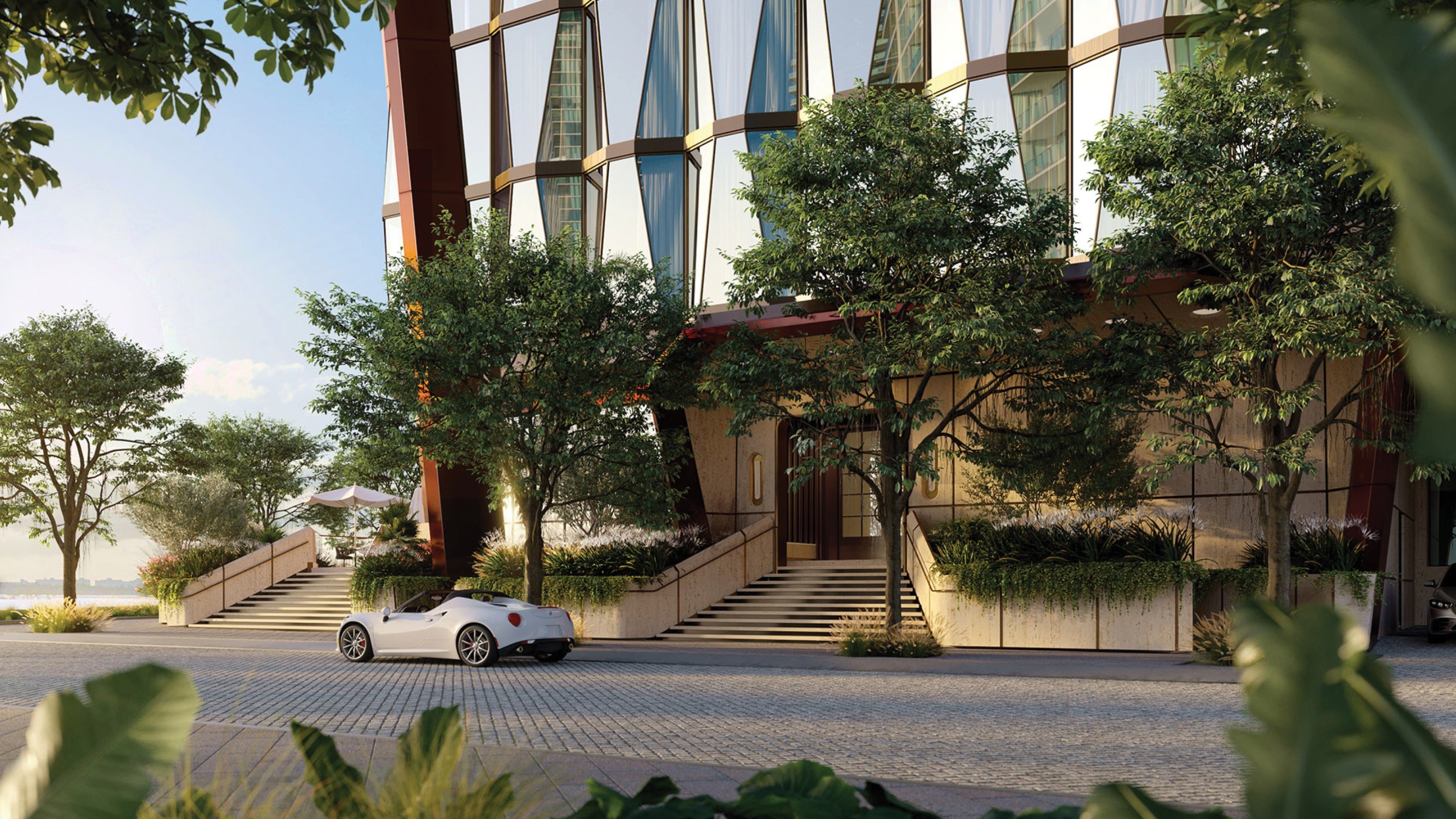 Villa Miami, Edgewater modern waterfront tower with porte‑cochère, palms and sports‑car arrival, iconic address of luxury and ultra luxury condos; preconstruction. Featuring building, exterior, and landscaping.