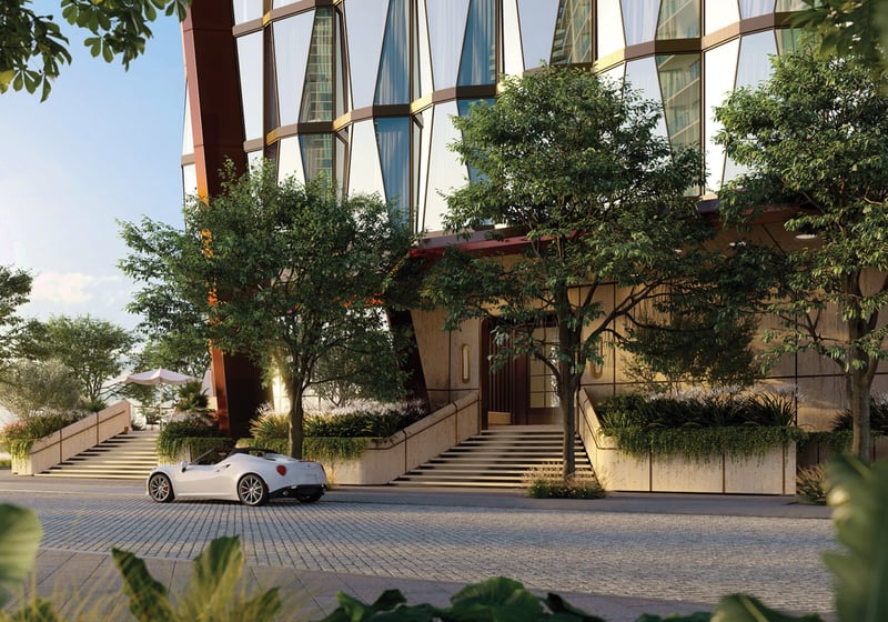 Villa Miami, Edgewater modern waterfront tower with porte‑cochère, palms and sports‑car arrival, iconic address of luxury and ultra luxury condos; preconstruction. Featuring building, exterior, and landscaping.