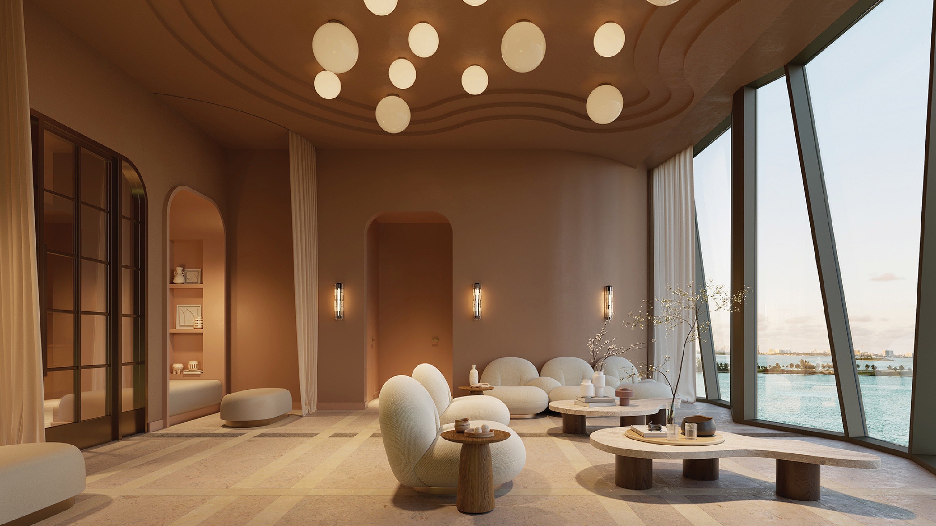 Villa Miami, Edgewater residents’ lounge framed by Biscayne Bay—club‑style comfort for luxury and ultra luxury condos; preconstruction.