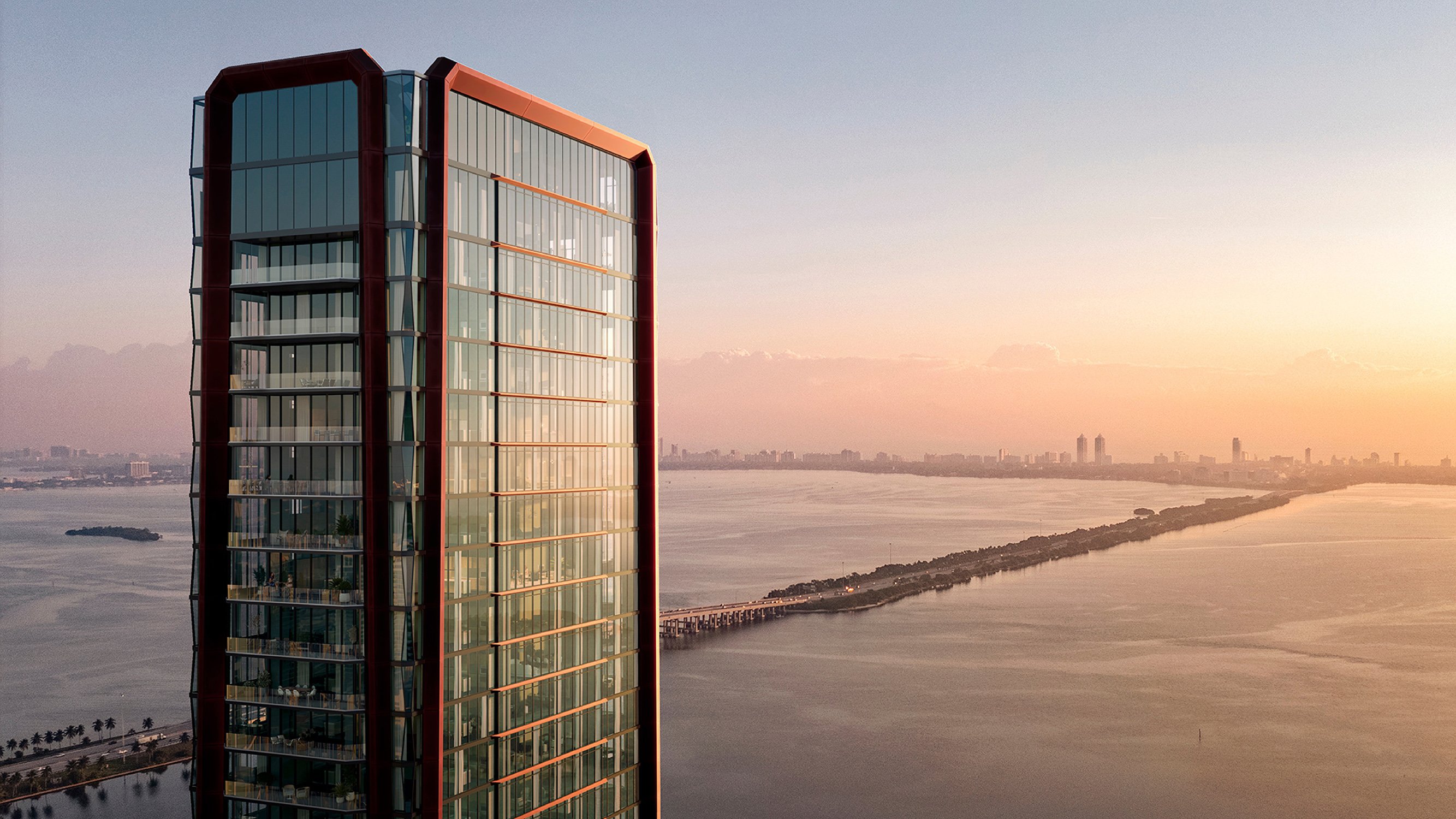 Villa Miami, Edgewater skyscraper at sunset with glowing façade over Biscayne Bay—iconic address for luxury and ultra luxury condos; preconstruction.