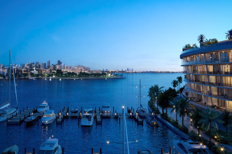 Vita at Grove Isle, Coconut Grove night skyline over marina and towers, private‑island luxury and ultra luxury condos; preconstruction. Featuring Miami, waterfront, view, and skyscrapers.
