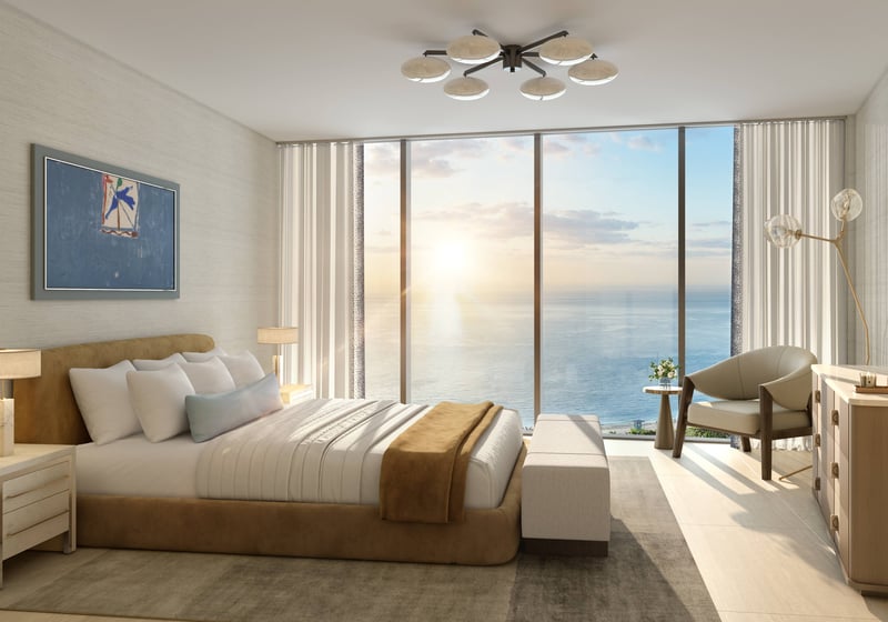 W Pompano Beach Residences bedroom with ocean view at sunrise, showcasing luxury and ultra luxury preconstruction condos. Featuring modern.