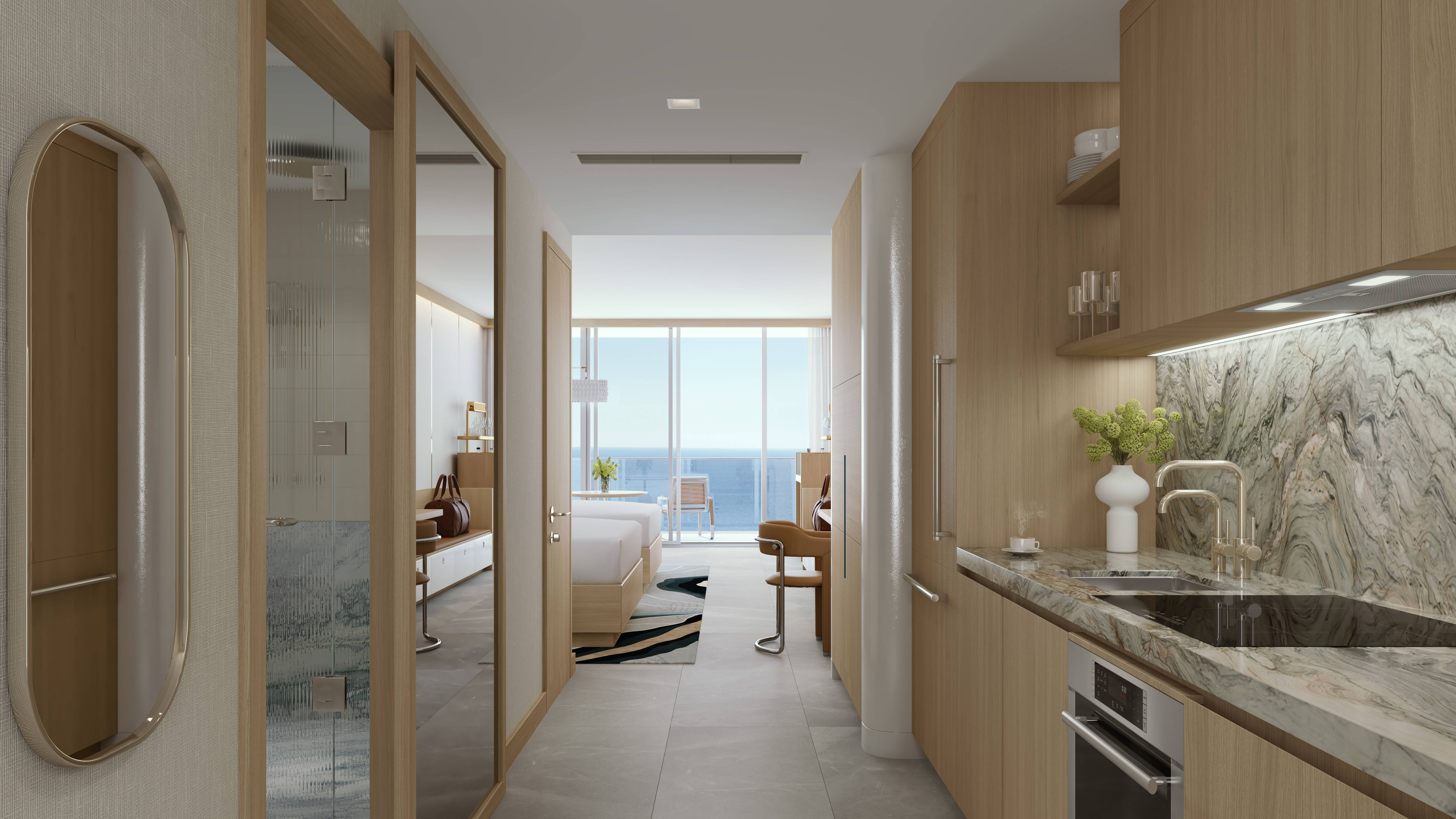 W Pompano Beach Residences kitchen and bedroom with ocean view, showcasing luxury and ultra luxury preconstruction condos. Featuring modern interior.