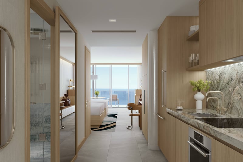 W Pompano Beach Residences kitchen and bedroom with ocean view, showcasing luxury and ultra luxury preconstruction condos. Featuring modern interior.