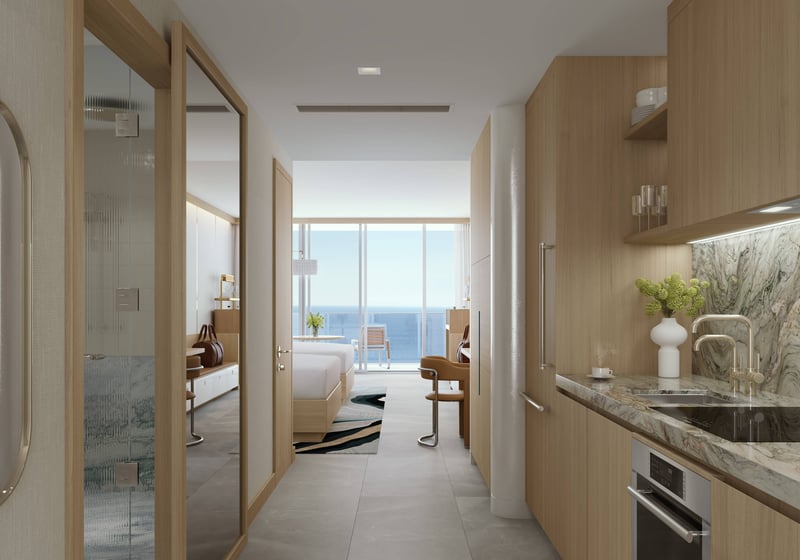 W Pompano Beach Residences kitchen and bedroom with ocean view, showcasing luxury and ultra luxury preconstruction condos. Featuring modern interior.