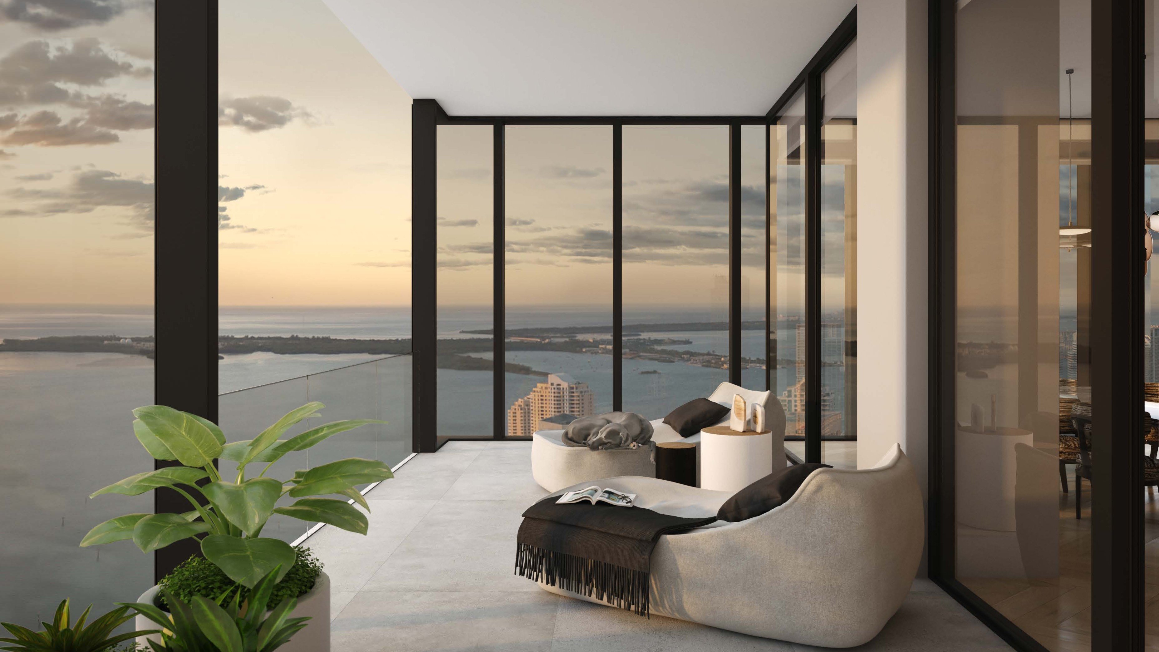 Waldorf Astoria Residences Miami, Downtown balcony at sunset with Miami skyline and Biscayne Bay, ultra luxury and luxury condos; preconstruction. Featuring modern and view.