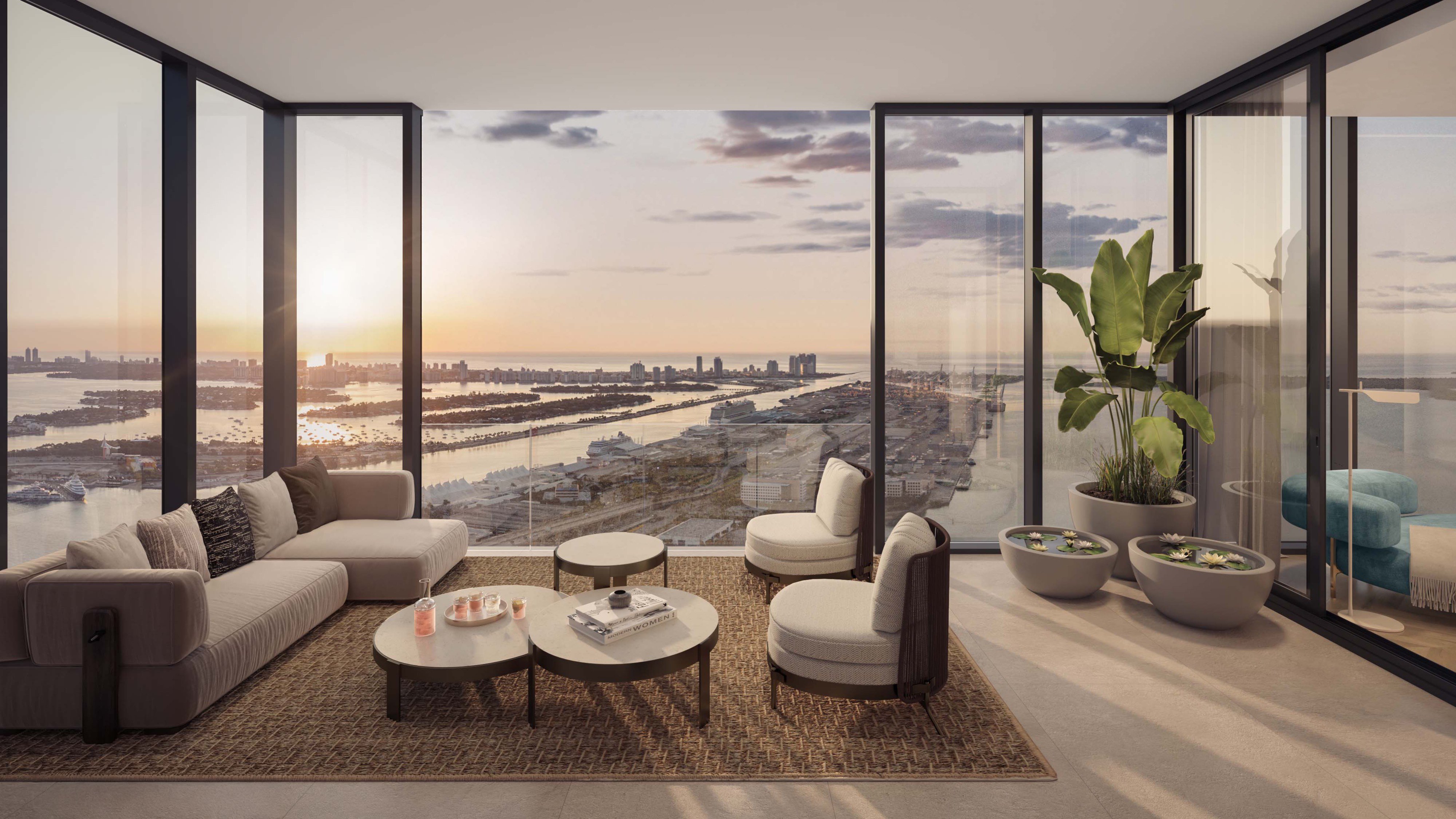 Waldorf Astoria Residences Miami, Downtown living room at sunset with city lights and bay, luxury and ultra luxury condos; preconstruction. Featuring modern and view.