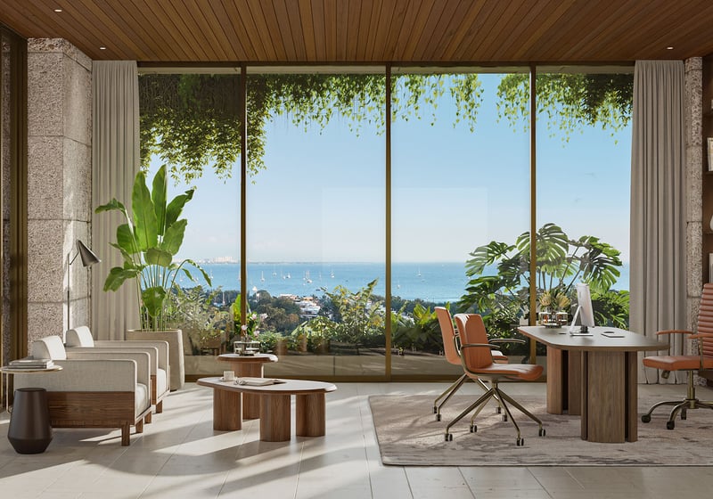 Executive office suite at Ziggurat Coconut Grove, Miami, Florida, with floor-to-ceiling glass overlooking Biscayne Bay, reflecting luxury finishes and ultra luxury preconstruction condos with private workspace options.