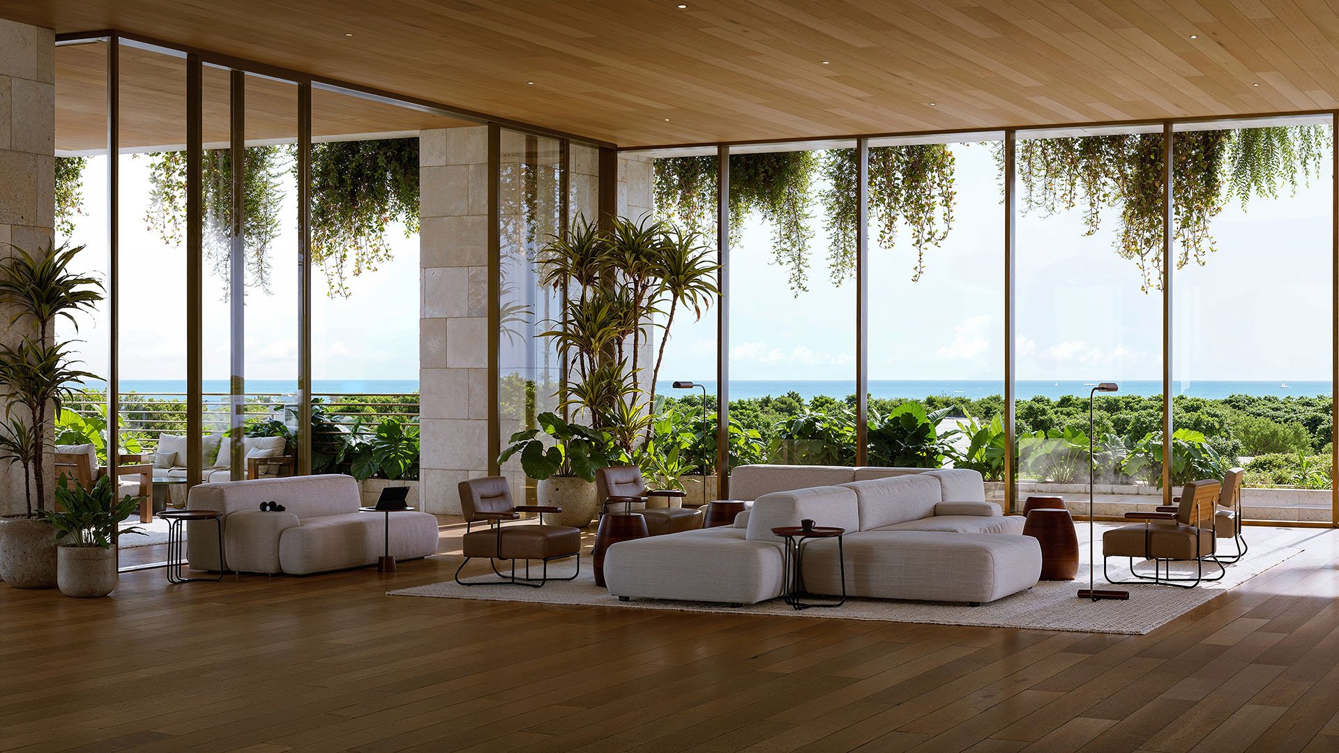 Ocean-view lobby lounge at Ziggurat Coconut Grove, Miami, Florida, with expansive glass walls, wood ceilings and resort greenery, paired with luxury amenities and ultra luxury preconstruction condos in a mixed-use setting.
