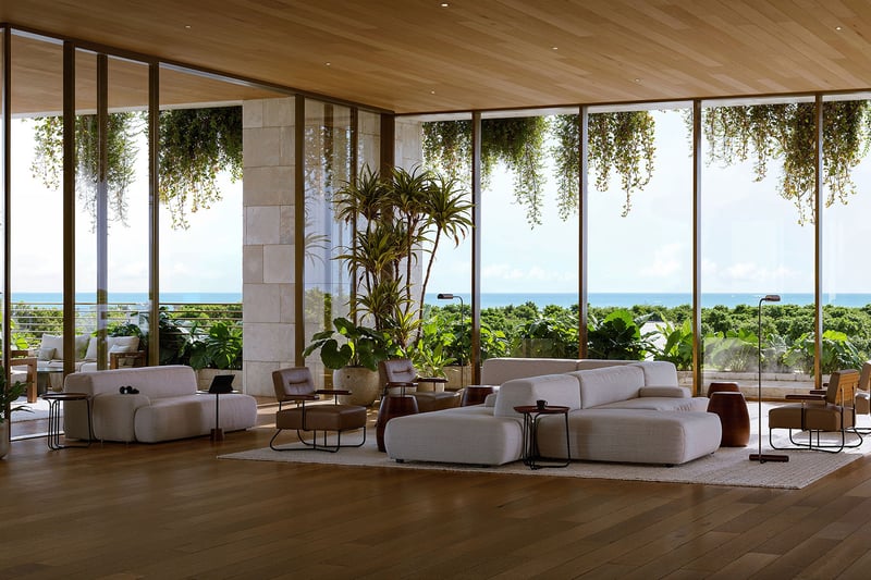 Ocean-view lobby lounge at Ziggurat Coconut Grove, Miami, Florida, with expansive glass walls, wood ceilings and resort greenery, paired with luxury amenities and ultra luxury preconstruction condos in a mixed-use setting.