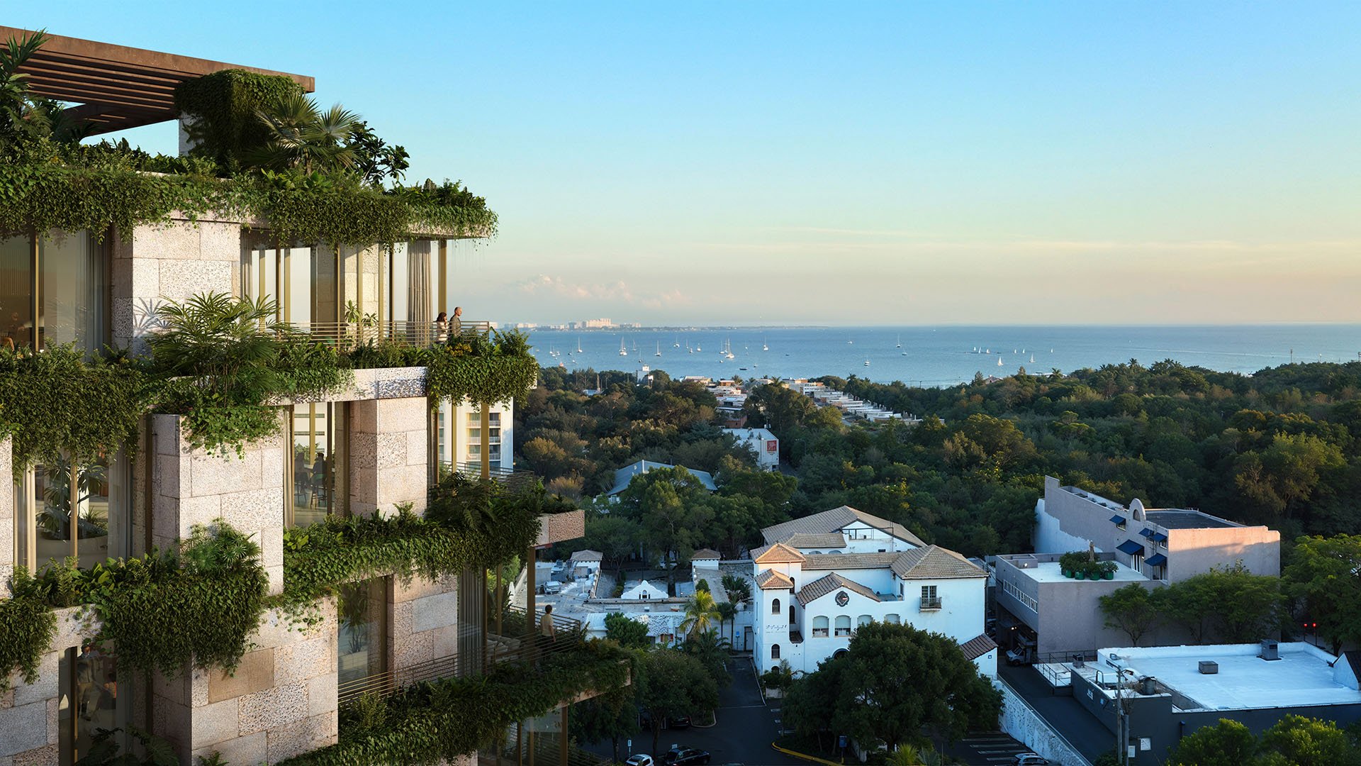 Green-terrace facade of Ziggurat Coconut Grove, Miami, Florida, overlooking Biscayne Bay and sailboats, highlighting luxury outdoor living and ultra luxury preconstruction condos with panoramic water views.