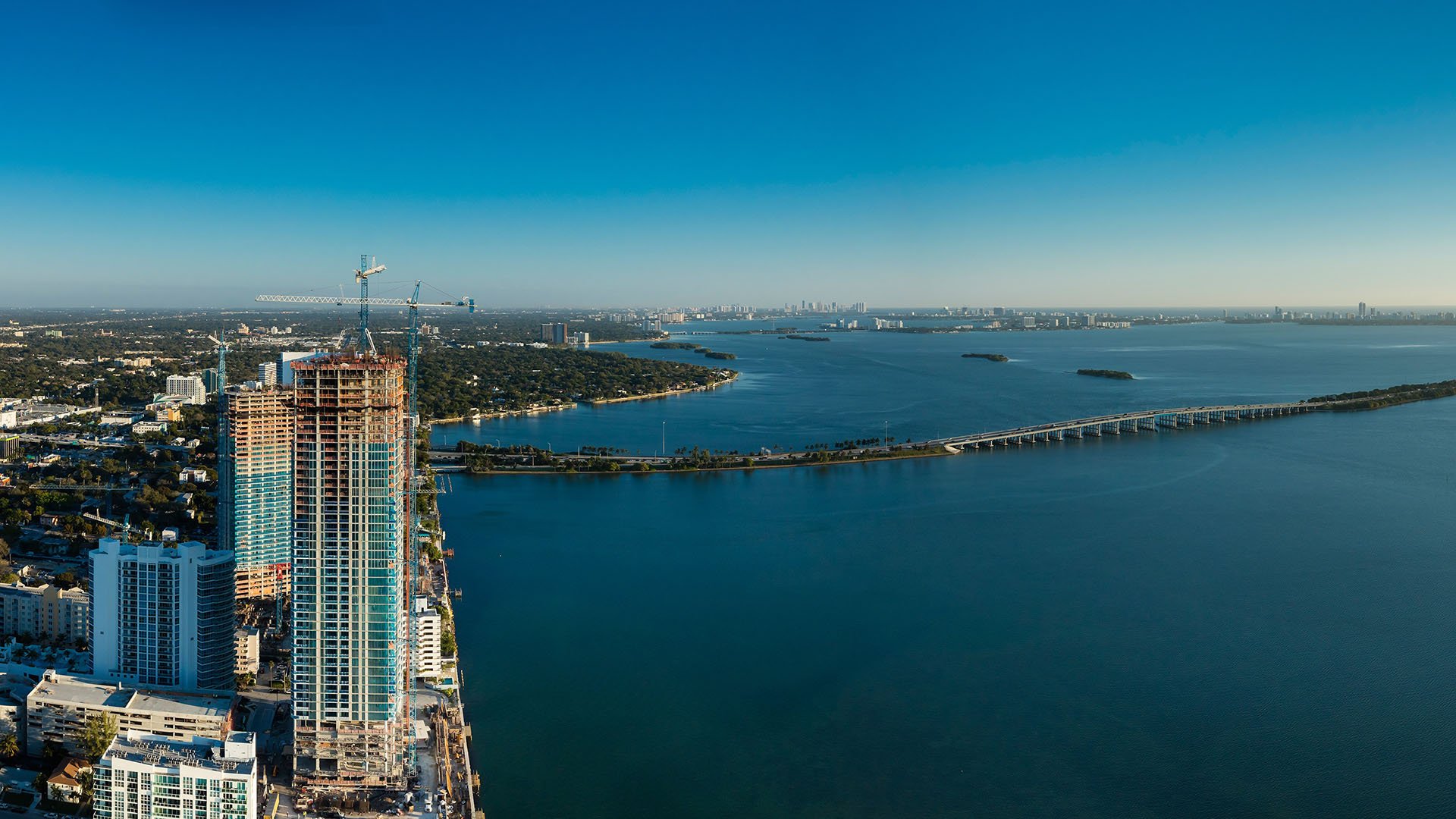 Missoni Baia Edgewater Miami aerial north view of preconstruction waterfront tower on Biscayne Bay near Julia Tuttle Causeway, representing luxury and ultra luxury condos.