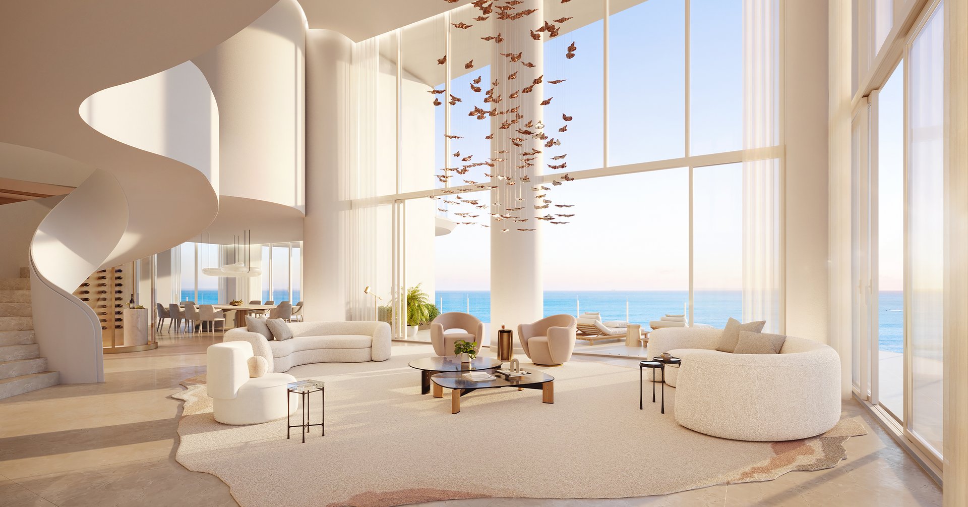 Set atop the tower's uppermost levels, the penthouse brings Kobi Karp's oceanfront architecture into dialogue with interiors by Alessandro Munge of Studio Munge. Floor-to-ceiling glazing and wraparound terraces open long views across the Atlantic Ocean, Miami Beach, Biscayne Bay, and the skyline beyond. Above the shoreline, it reads less as a residence than as a private house suspended in the sky.