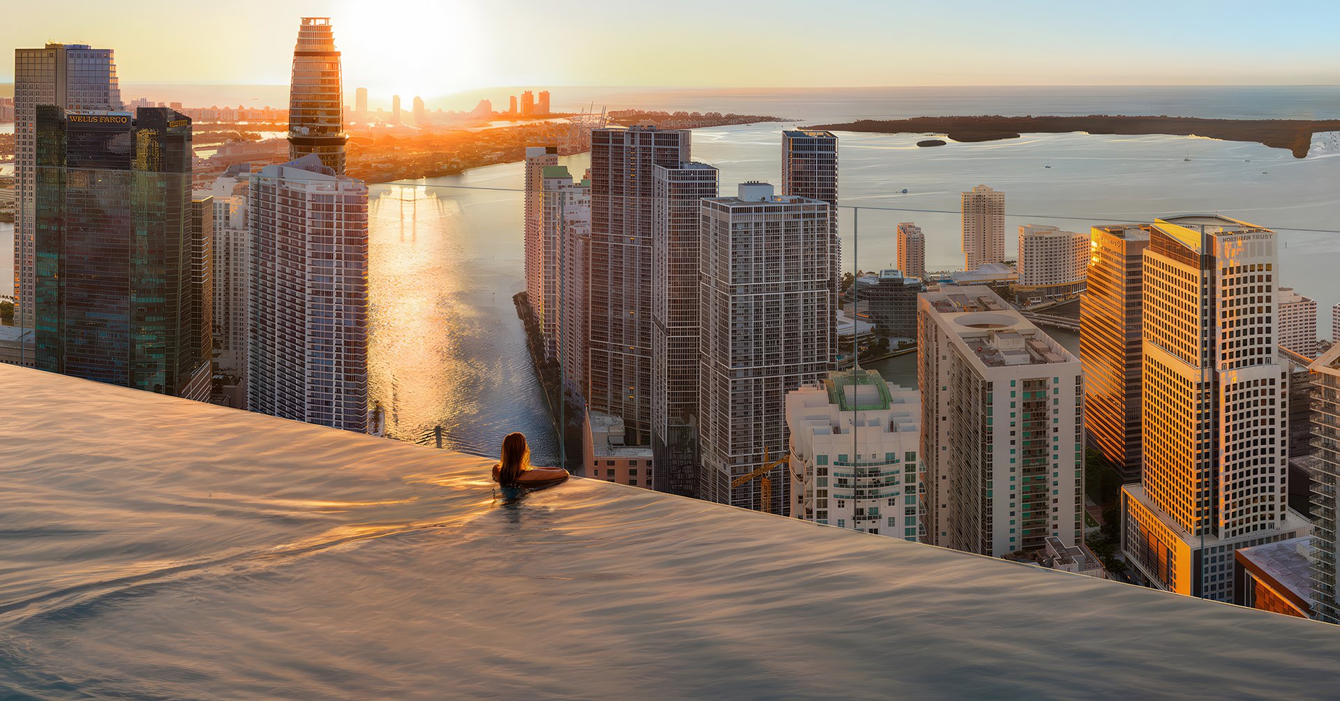 An Olympic-sized pool in the Sky Bridge with luxurious cabanas, and panoramic Miami views for premium relaxation and social entertainment.