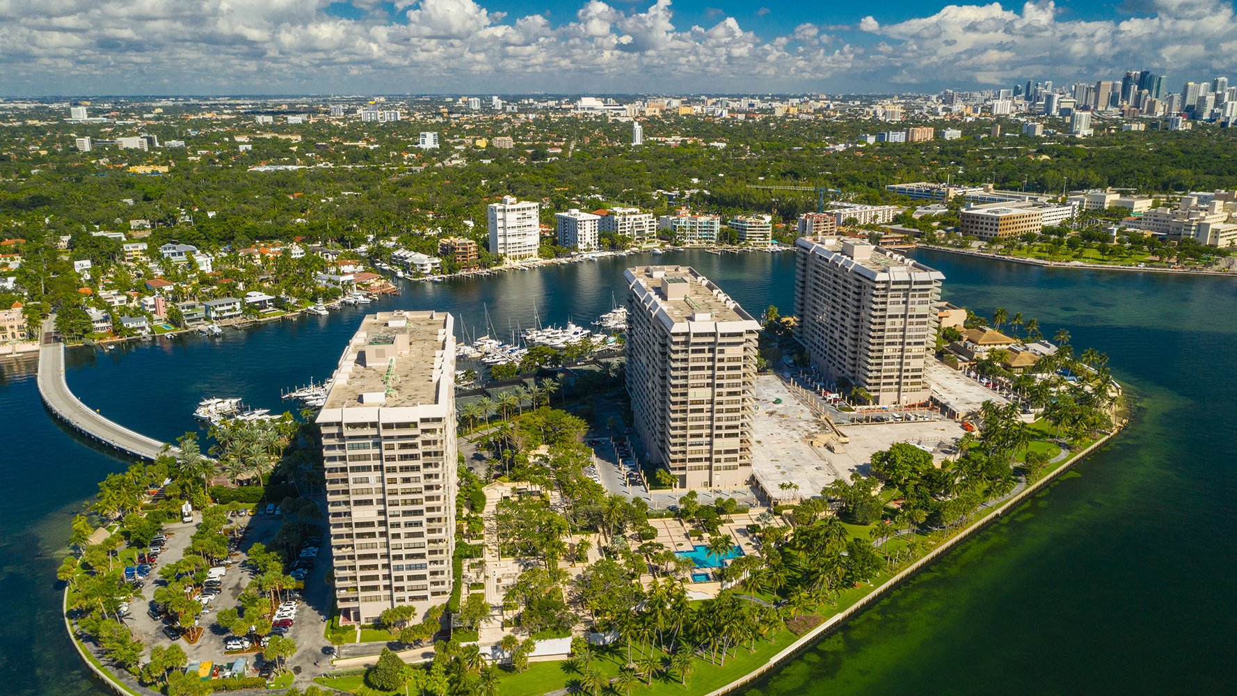 Coconut Grove aerial of waterfront high‑rises on Biscayne Bay—boutique enclave for luxury and ultra luxury condos, with preconstruction and resale options.