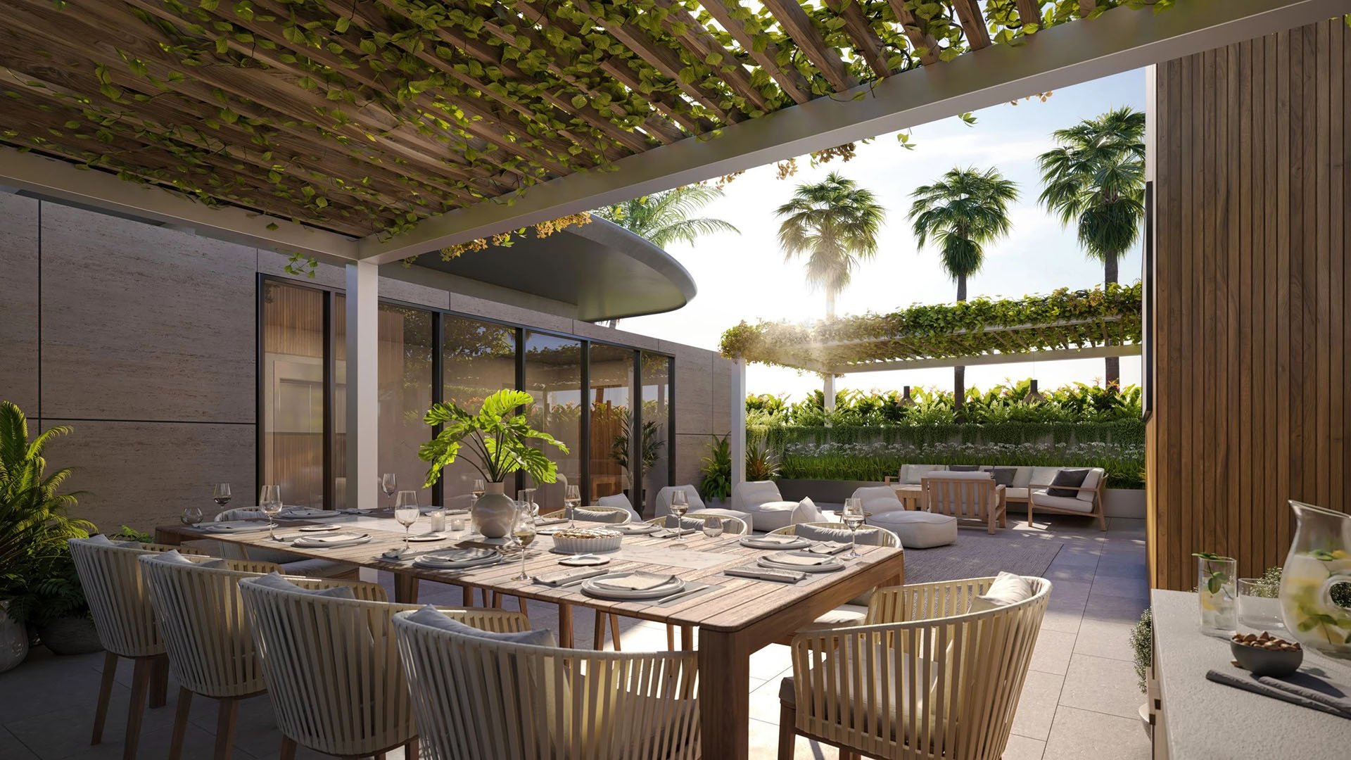 Indian Creek Residences and Yacht Club outdoor dining terrace under vine pergola with lounge seating and tropical landscaping, Bay Harbor Islands, Miami area, Florida, luxury and ultra luxury preconstruction condos amenities.