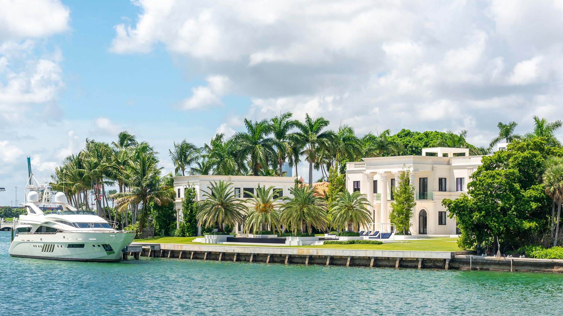 Miami Beach ultra luxury waterfront estate with private yacht—yachting lifestyle amid nearby luxury and ultra luxury condos; high‑end resale.