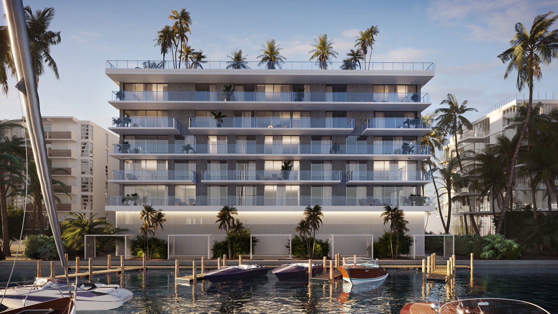 Golden hour view of Origin Residences Bay Harbor Islands waterfront exterior with boats docked, palm trees and glass balconies in Miami, Florida, showcasing luxury and ultra luxury preconstruction condos and marina living.