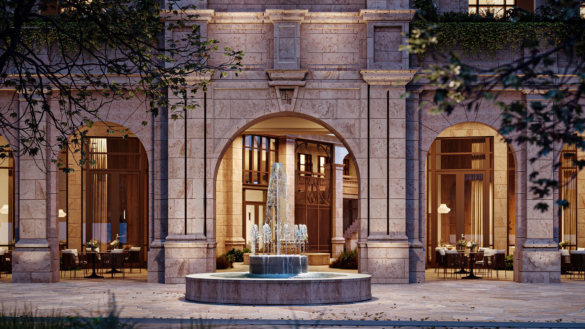 Ponce Park Residences Coral Gables, Miami evening courtyard with stone arches and central fountain, featuring luxury and ultra luxury preconstruction condos with classic arcade entry and warm ambient lighting.
