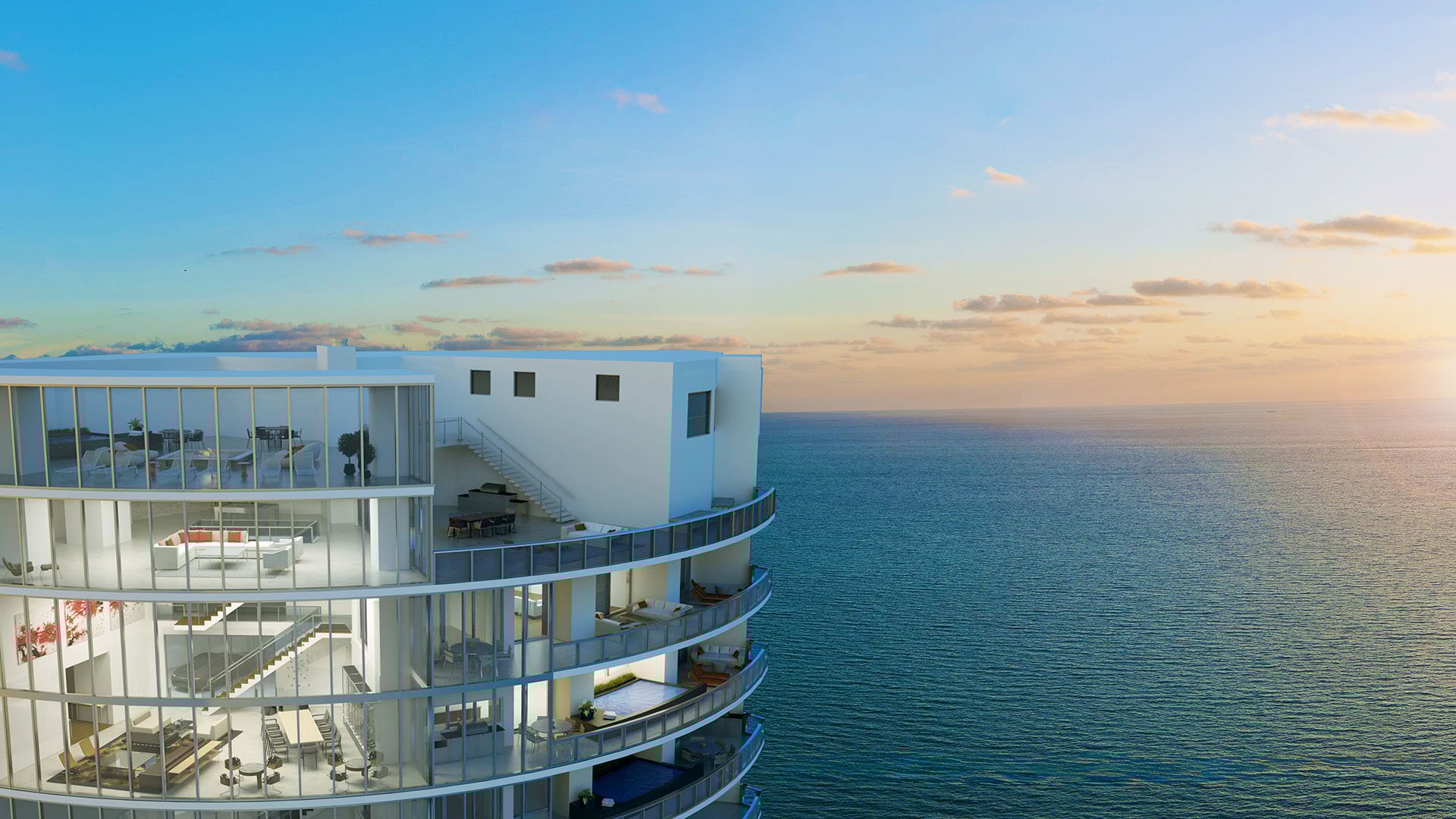 Porsche Design Tower Sunny Isles Beach luxury ultra luxury condos with penthouse-level terraces, expansive glass walls, and a dramatic sunset waterfront view over the ocean in Sunny Isles Beach.