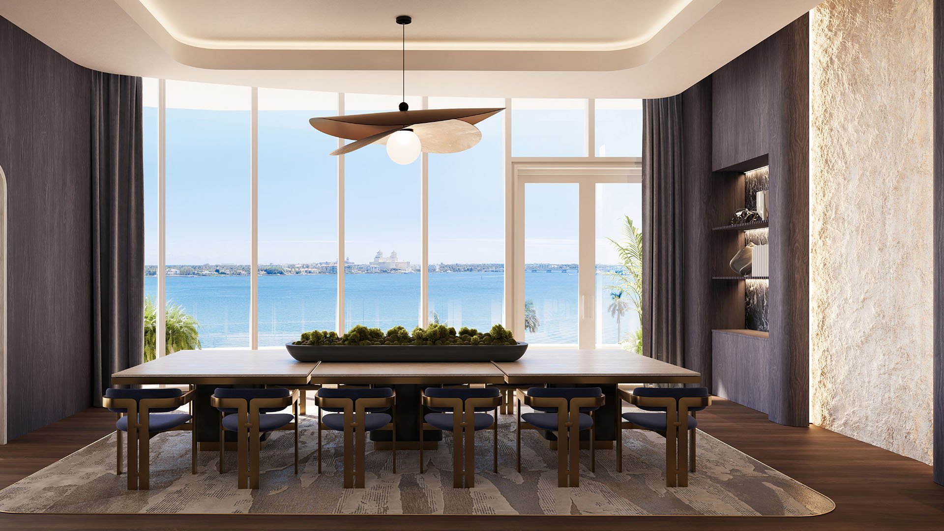 Shorecrest Flagler Drive private dining room in West Palm Beach, Florida, with long table, statement pendant and waterfront views - luxury and ultra luxury preconstruction condos entertaining space.