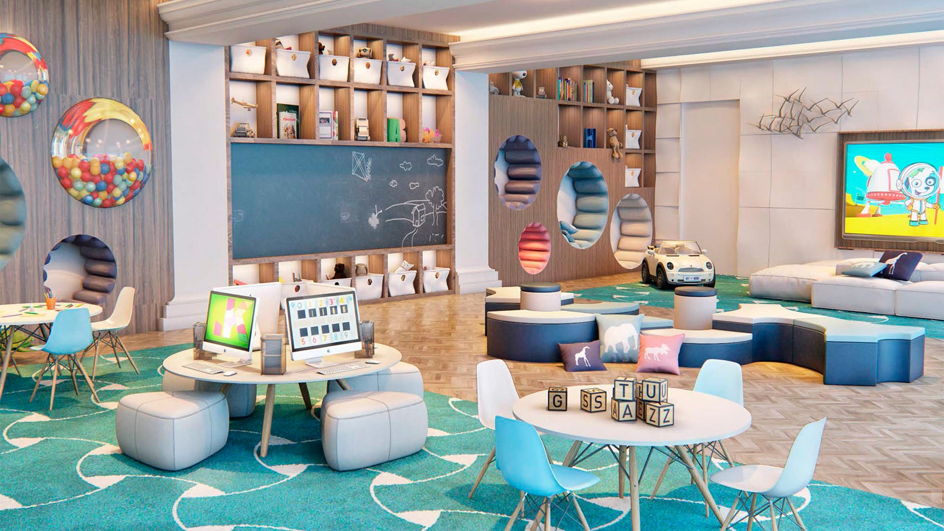 Children's playroom and activity lounge with games, seating, and colorful decor at The Estates at Acqualina, Sunny Isles Beach, a community of luxury and ultra luxury condos.
