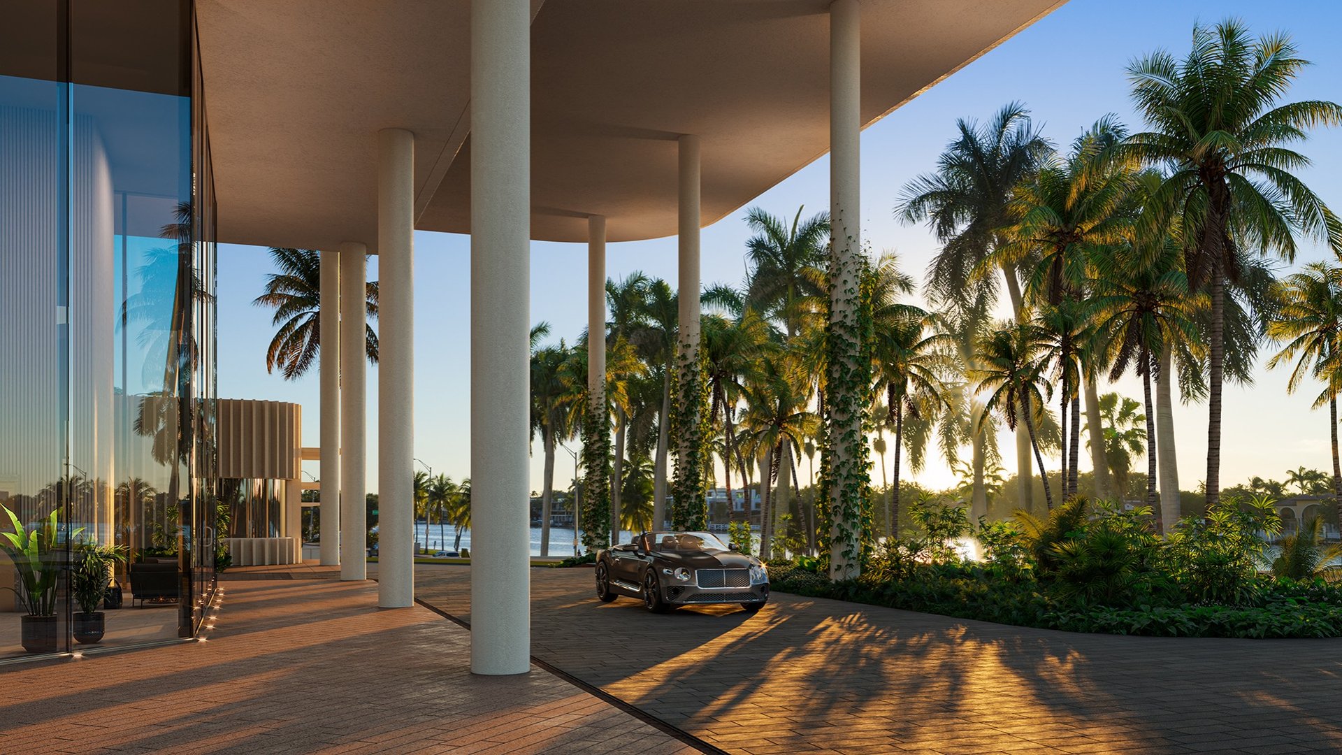 The Perigon Miami Beach contemporary home exterior at sunset with palms and luxury car—Miami Beach luxury and ultra luxury condos, preconstruction.