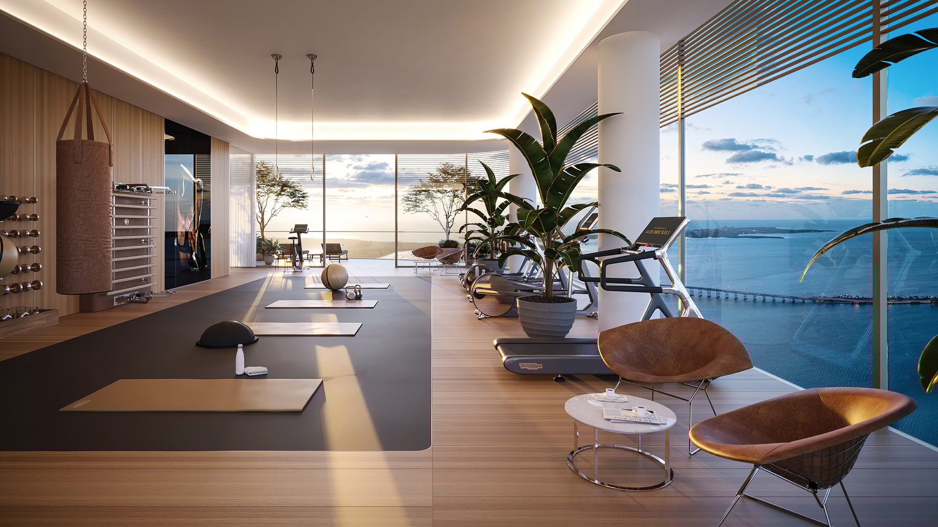 The Residences at 1428 Brickell home gym with water view—Brickell, Miami; wellness amenity for luxury and ultra luxury condos, preconstruction.