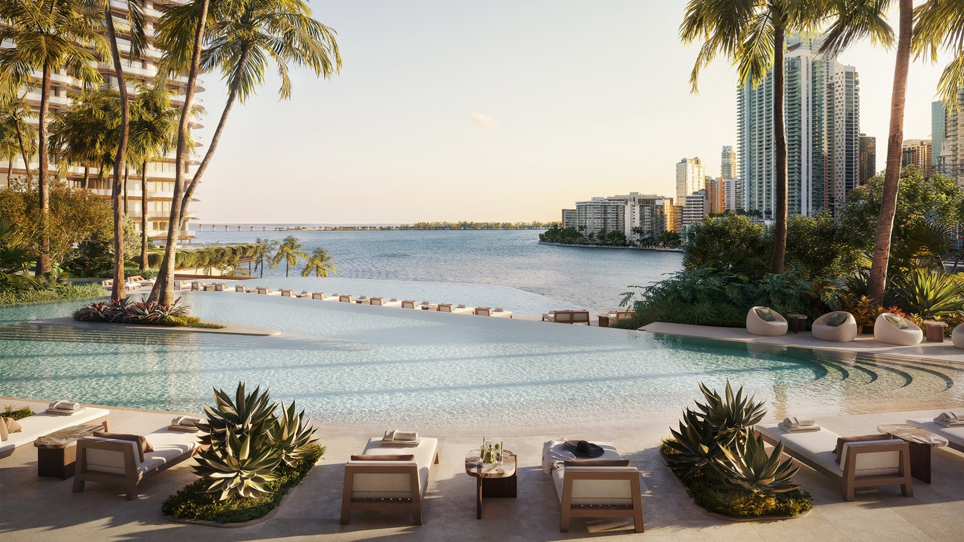 The Residences at Mandarin Oriental, Brickell Key Miami poolside with cityscape—waterfront luxury and ultra luxury condos; preconstruction.