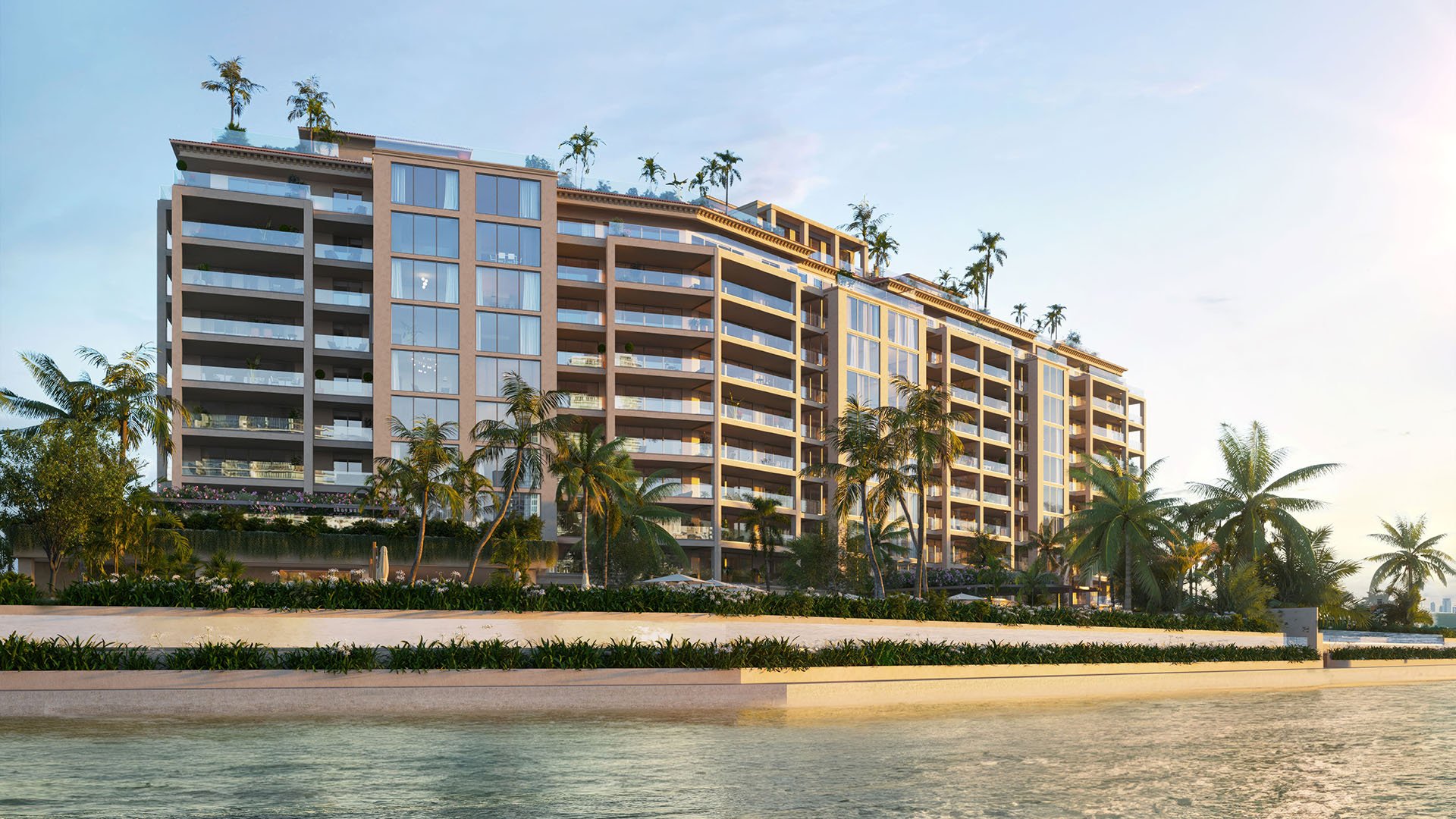Sunset Intracoastal view of The Residences at Six Fisher Island, Fisher Island Miami Beach, Florida, showing rooftop terrace palms and wide balconies above the seawall, emphasizing luxury and ultra luxury preconstruction condos.