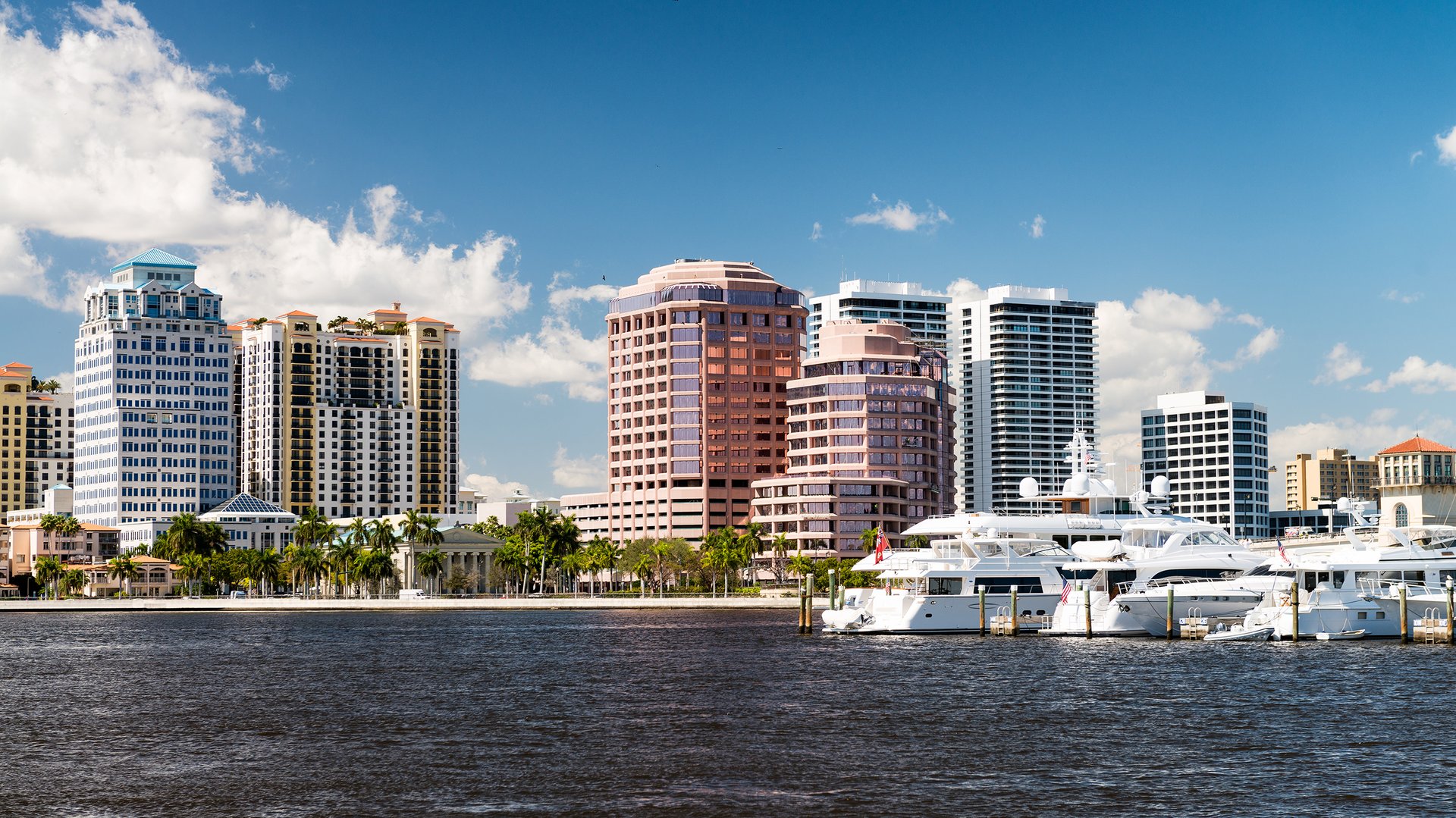 West Palm Beach skyline and marina by day, Intracoastal waterways and high‑rises—vibrant zone of luxury and ultra luxury condos; preconstruction and resale.
