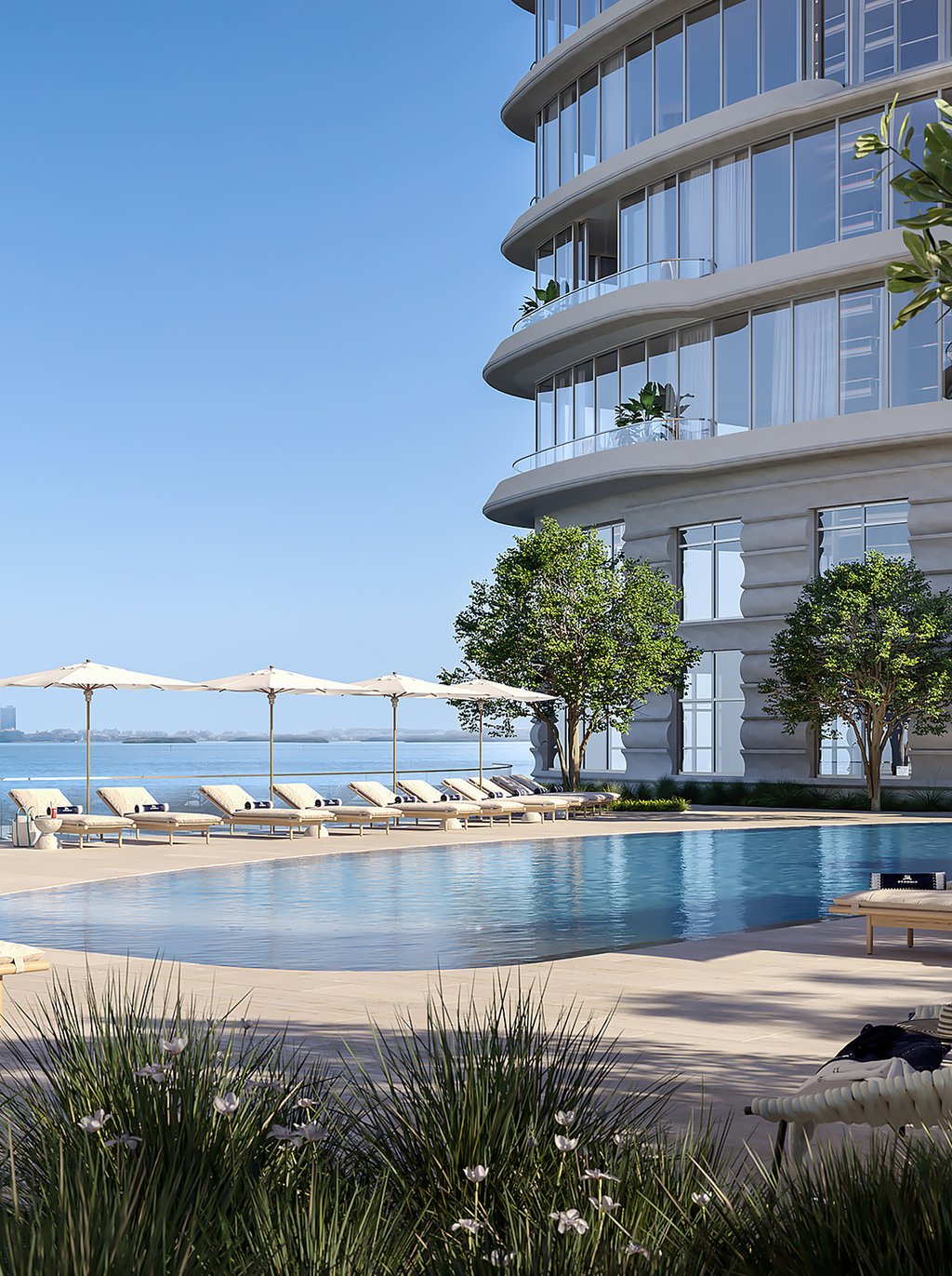 Residents will enjoy a bayfront infinity pool and whirlpool with private cabanas, and a garden with seating areas. The deck also includes a poolside bar and café.