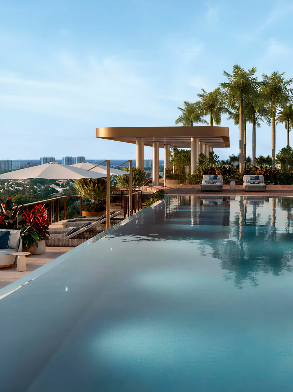 Above the city, a rooftop resort deck frames sunrise-to-sunset views with an infinity pool, private cabanas, and relaxed lounge settings. Outdoor grills and dining areas invite effortless entertaining, while an open-air cinema and the residents-only Mr. C Bar & Lounge complete the scene.