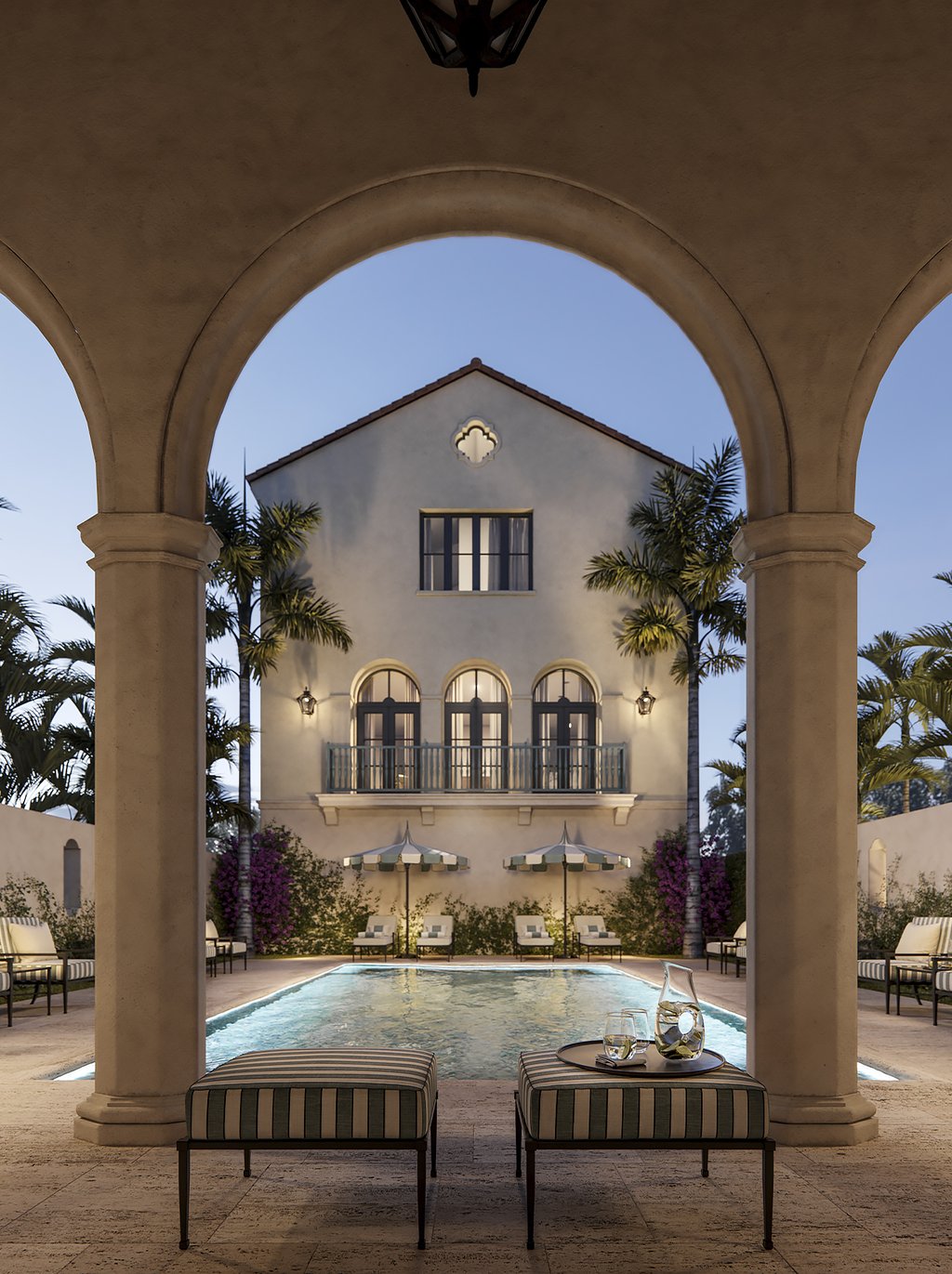 The pool area includes tropical landscaping, sunbeds, umbrellas, and chairs to enjoy the best sunrises and sunsets of South Florida.